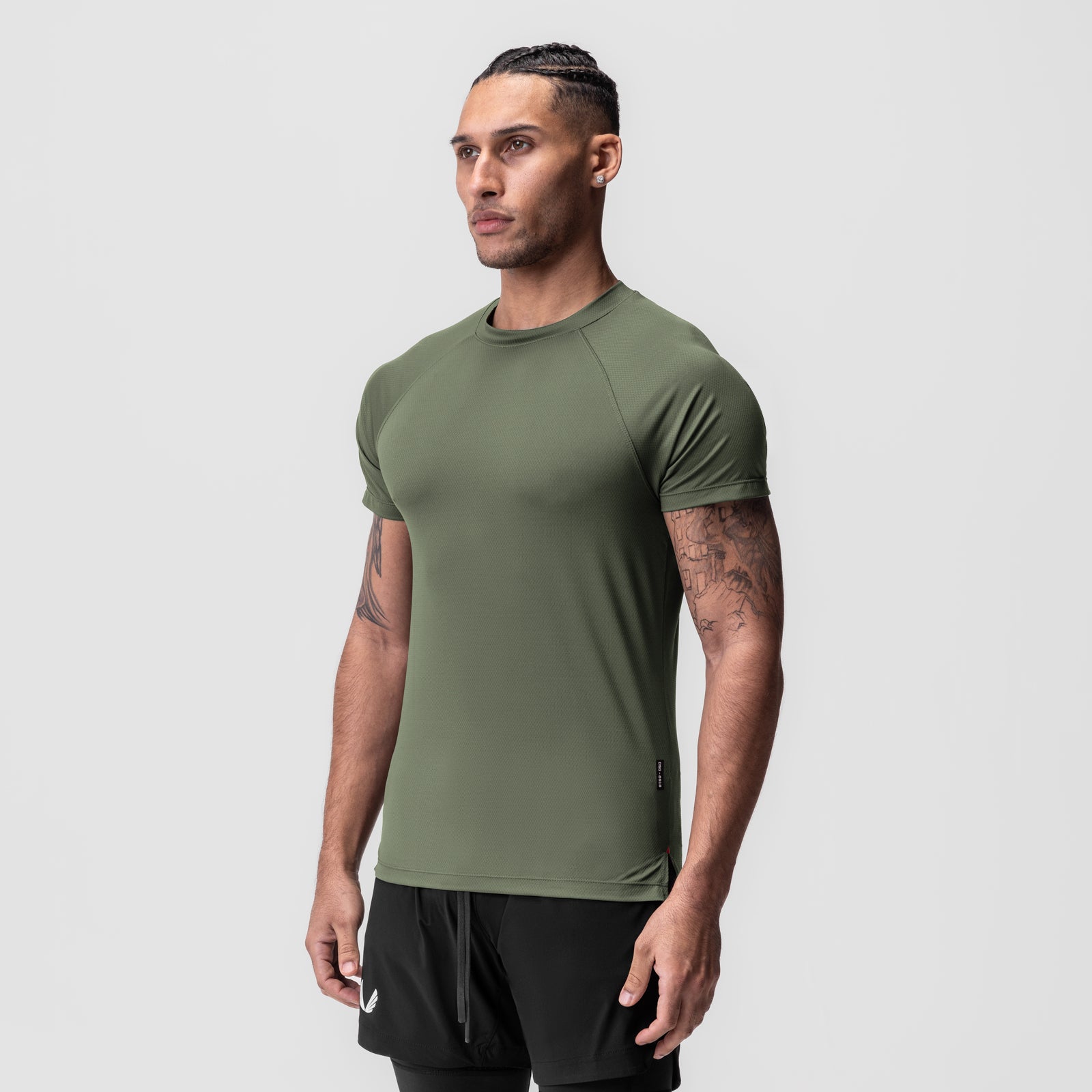 AeroSilver® Fitted Tee in olive, modeled front-facing with black shorts