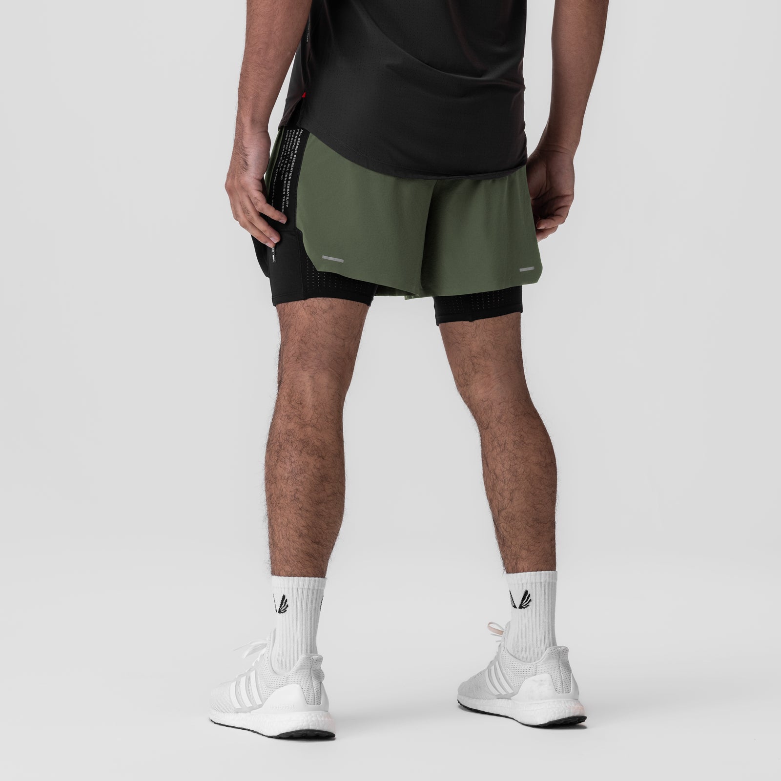 Aerotex Hybrid Liner Short in olive and black, worn by model, back view