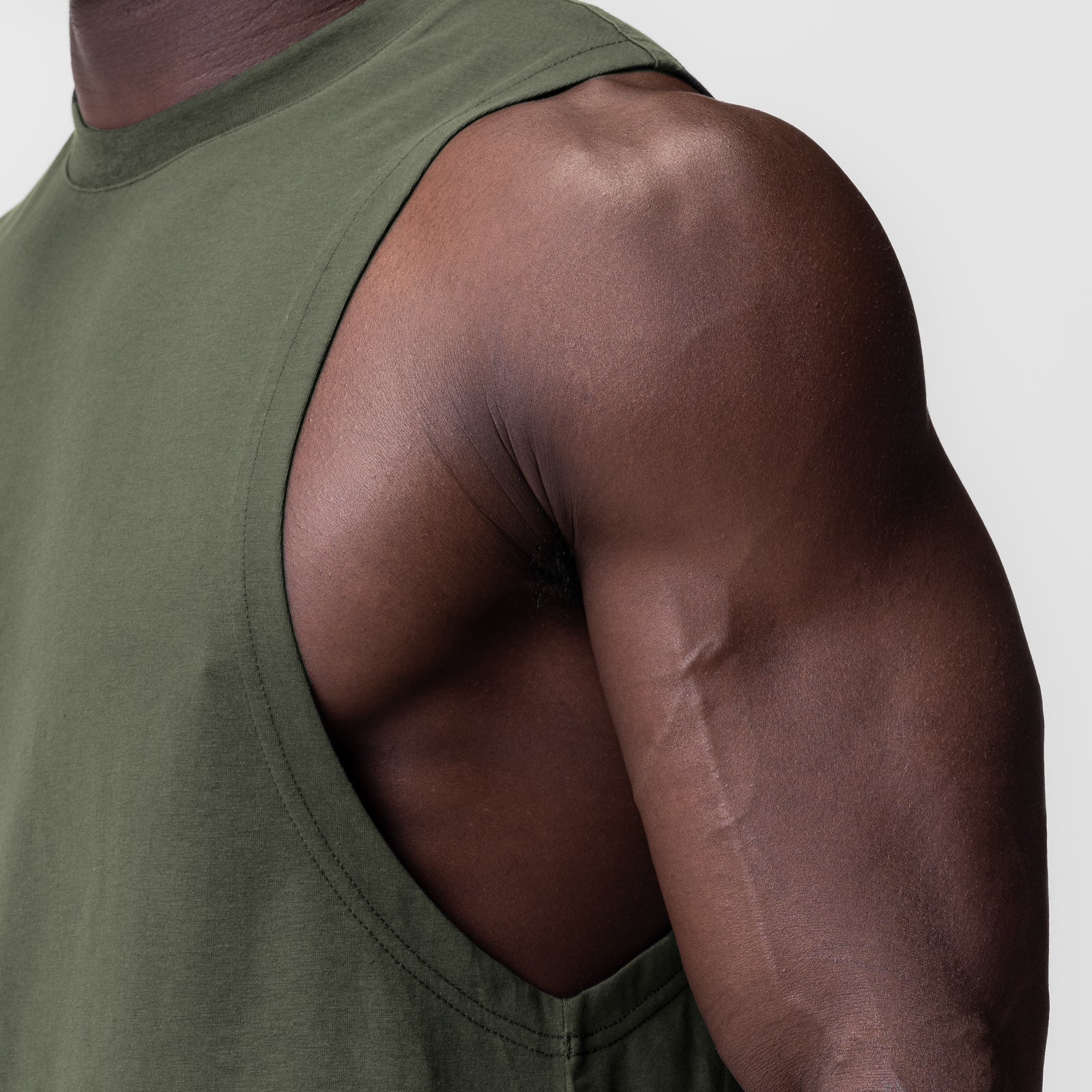 Supima® Muscle Tank in olive, worn by model showing shoulder and arm detail