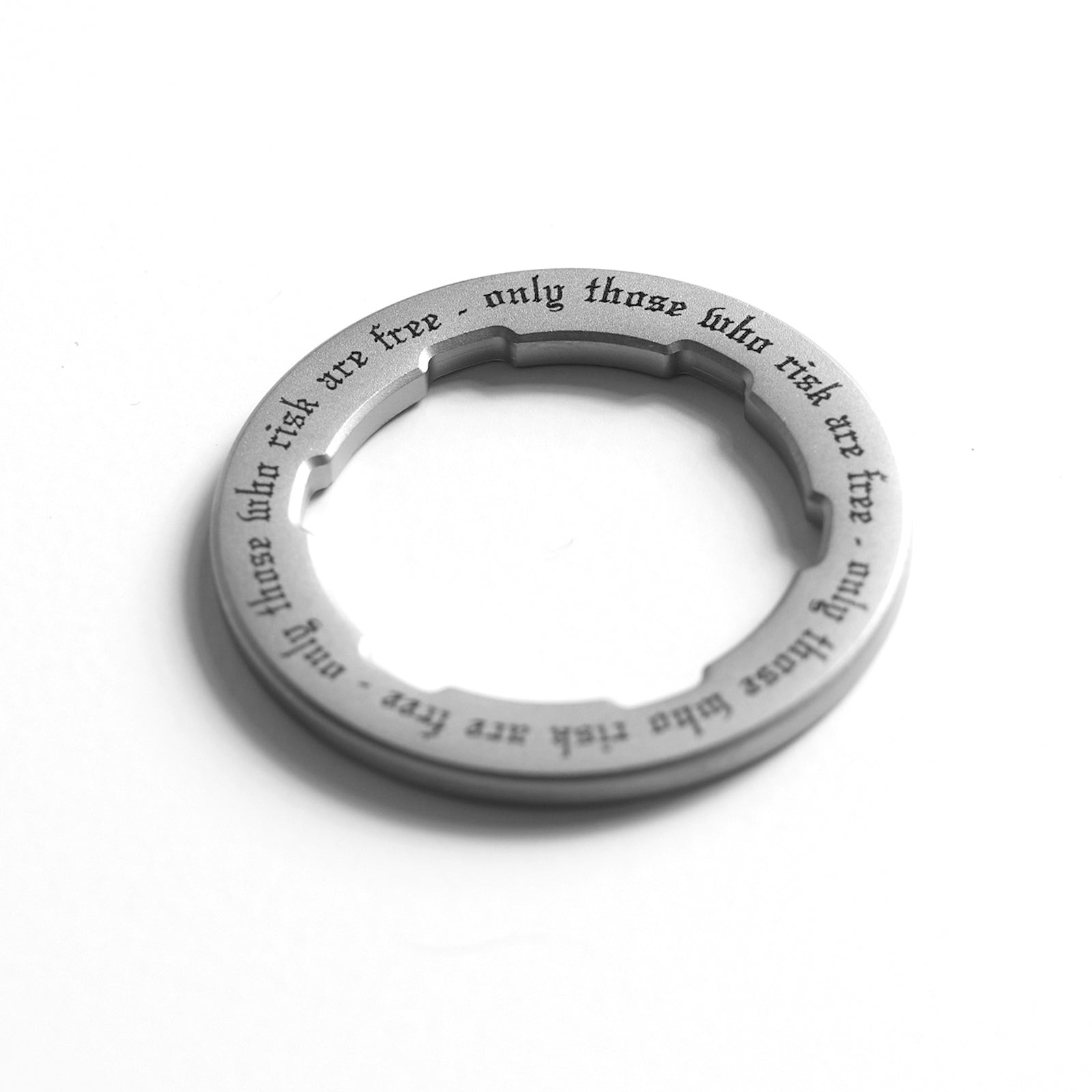 flatlay OTWR Pendant in stainless steel, ring view from above