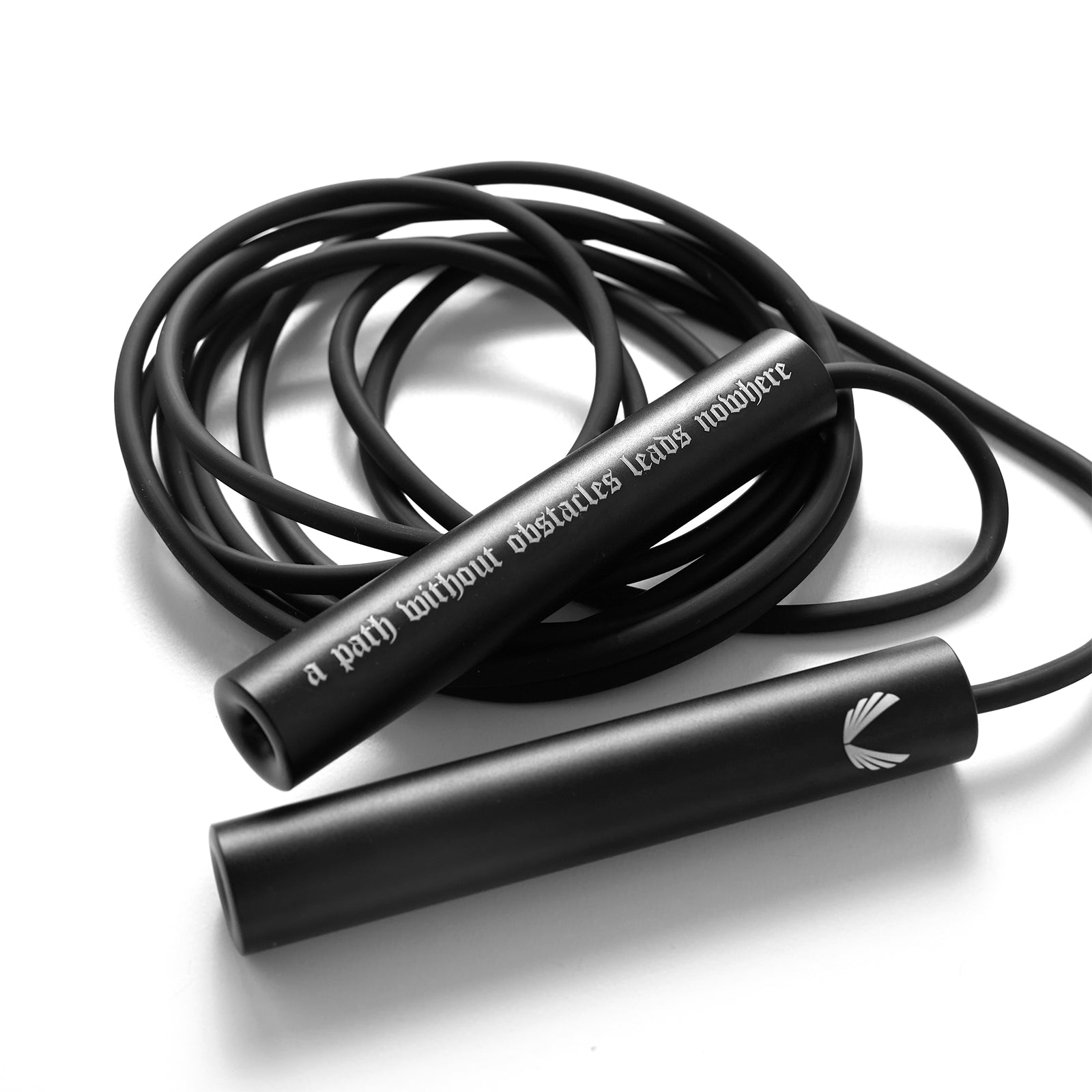 of Mantra Jump Rope in black with coiled cord, overhead view