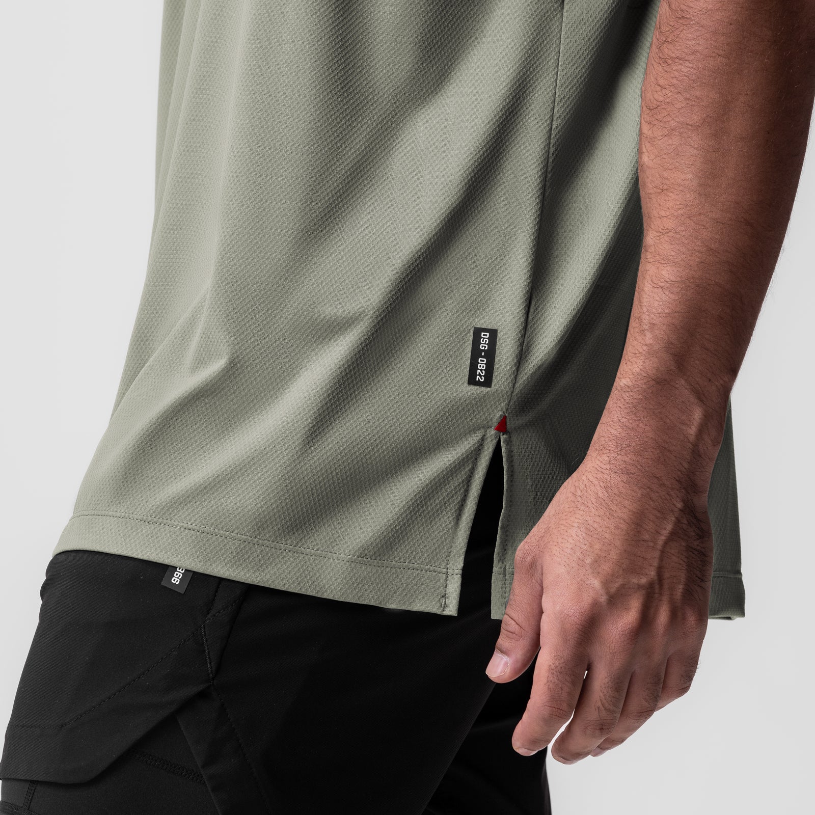 AeroSilver Oversized Tee in sage worn by model, side detail view