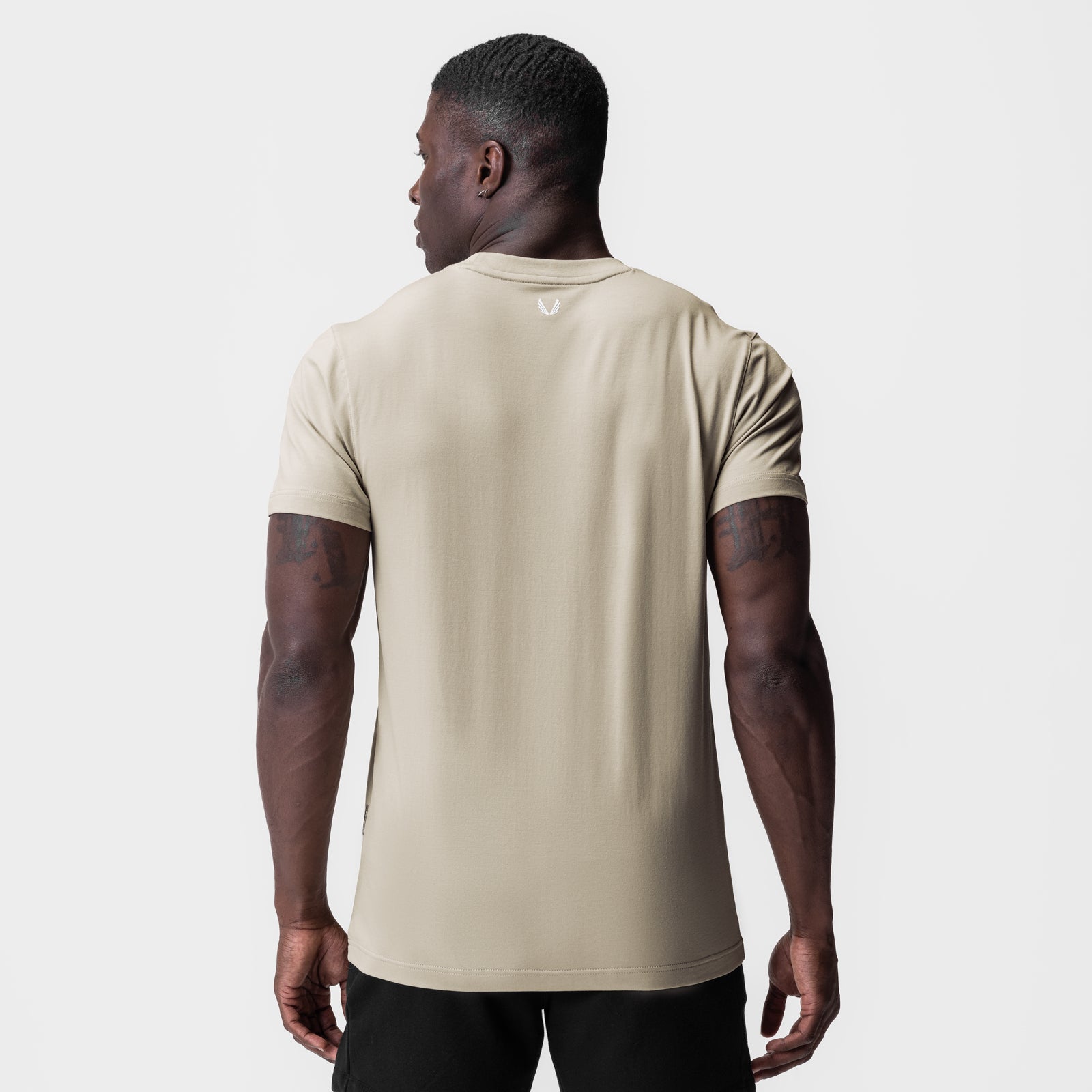 Supima Essential Tee in Sand Smoke worn by model, back view