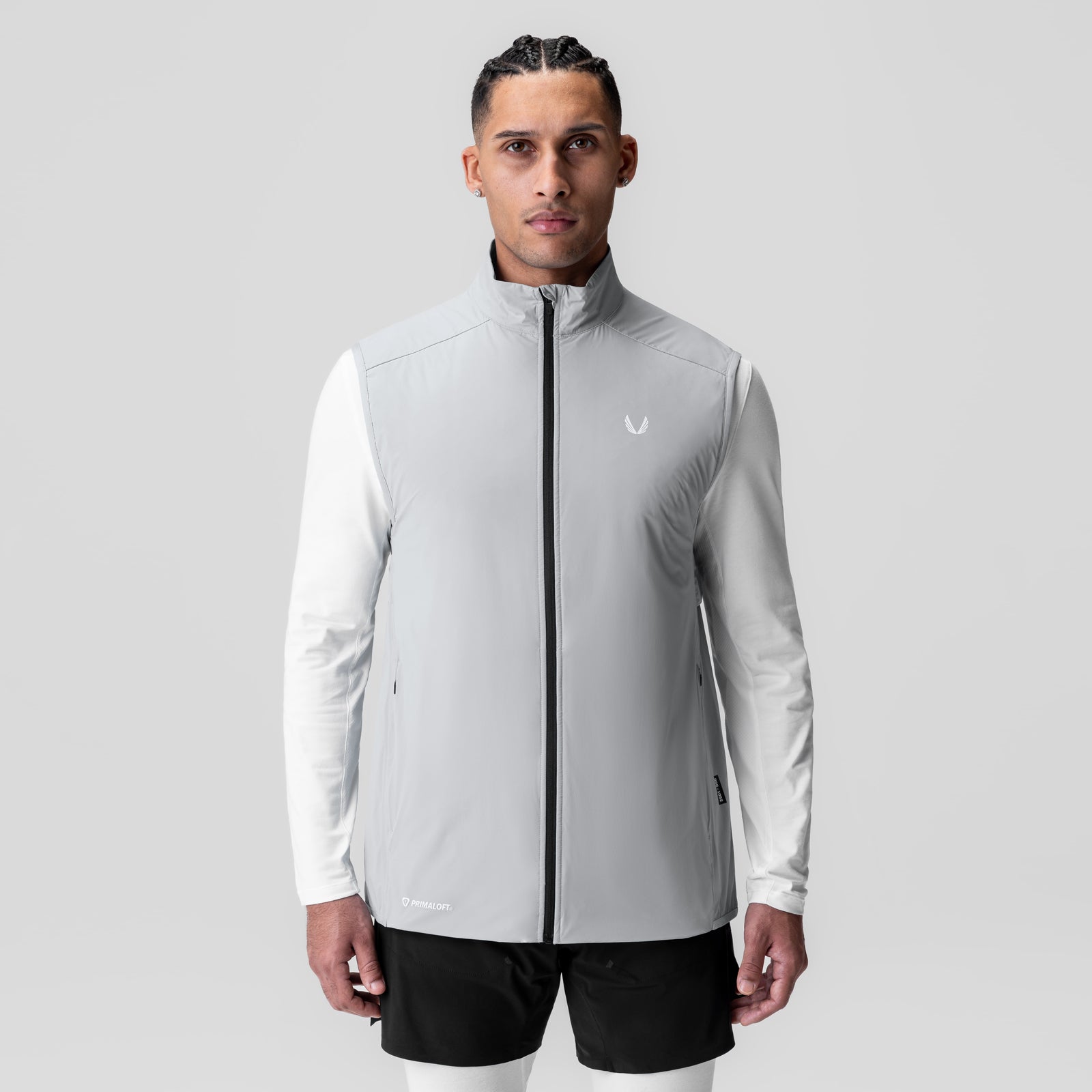 Aerotex PrimaLoft Run Vest in slate grey with white long-sleeve shirt, front view on model