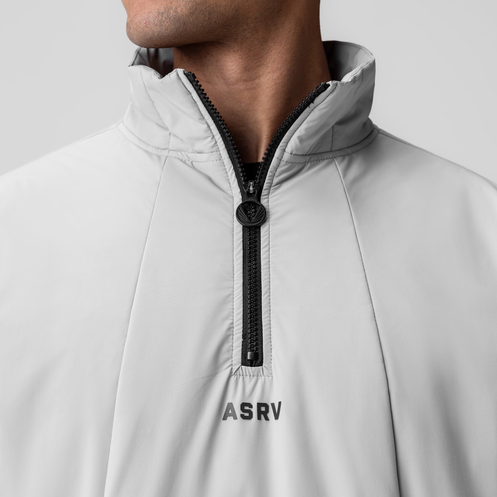Aerotex PrimaLoft Quarter Zip in white, worn by model showing front neckline and zipper detail