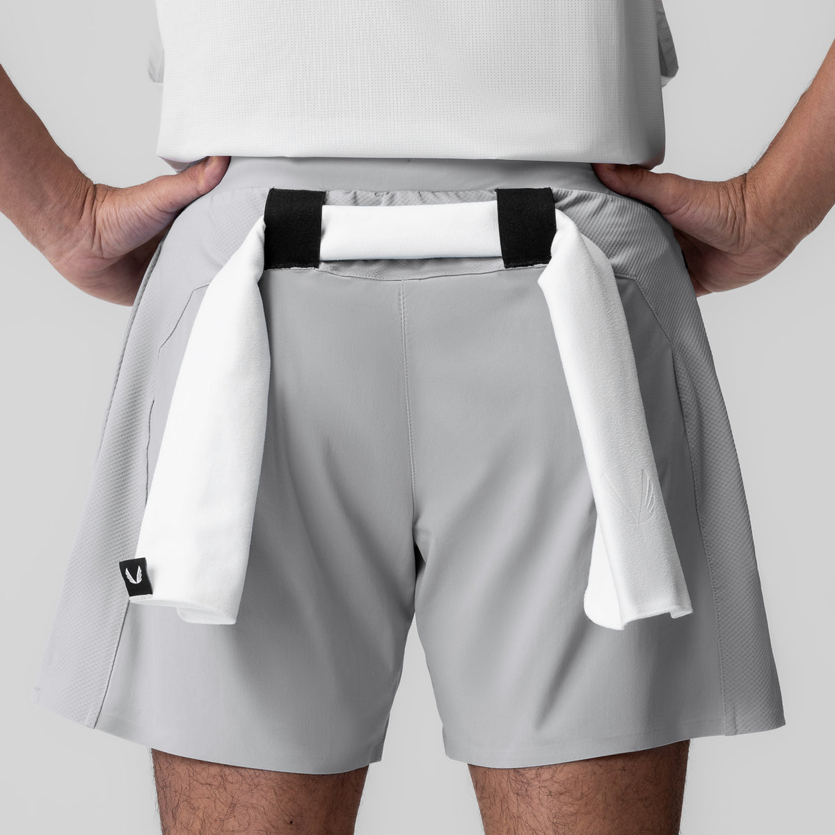 Tetra-Lite Bonded Training Short in Slate Grey, worn with towel draped over shoulder