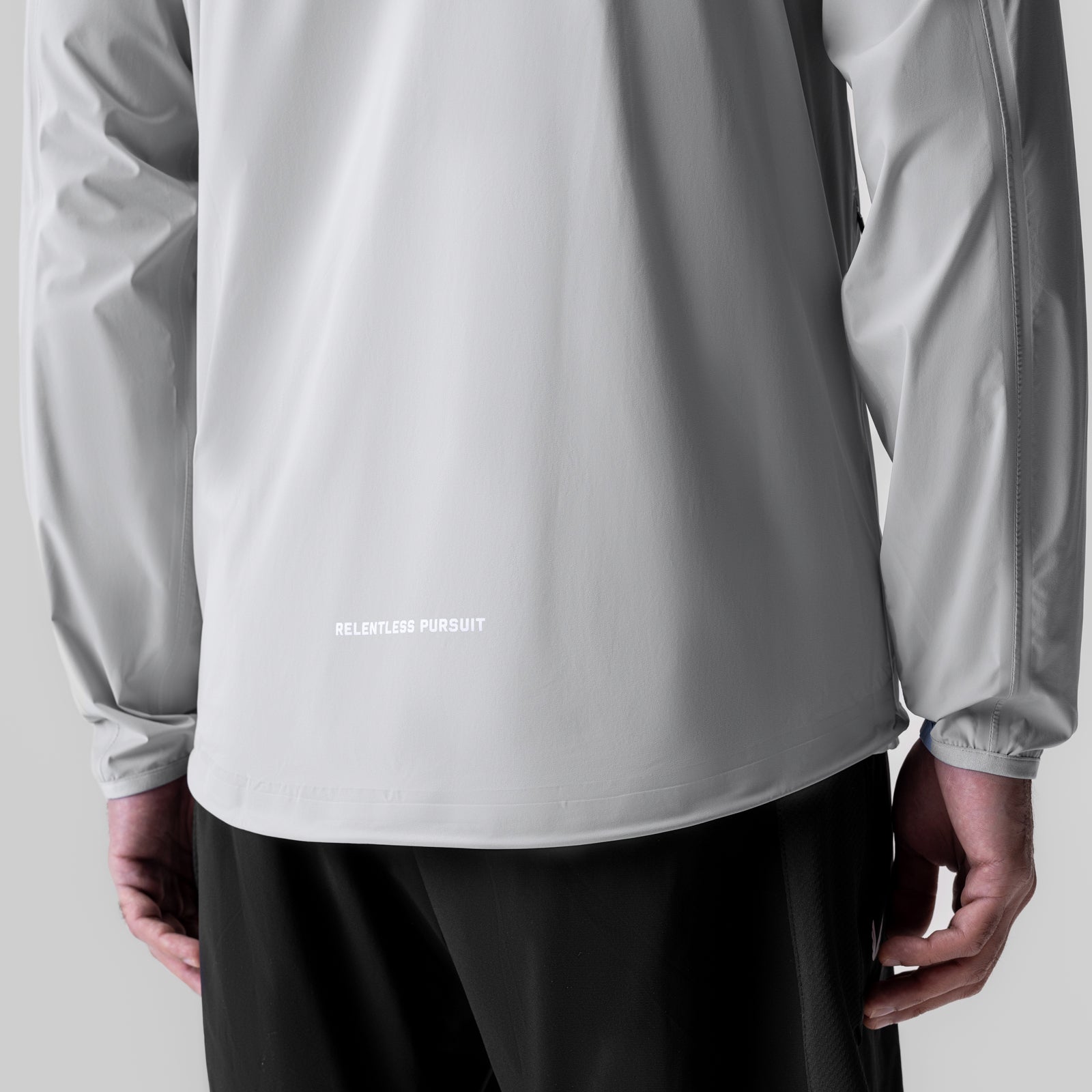 Aerotex™ Lightweight Windbreaker in slate grey worn by model, back view