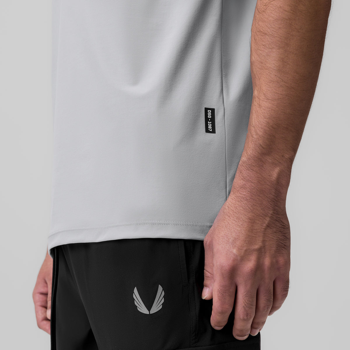 Tetra-Lite Ice Zip Tee in slate grey worn by model, side detail view