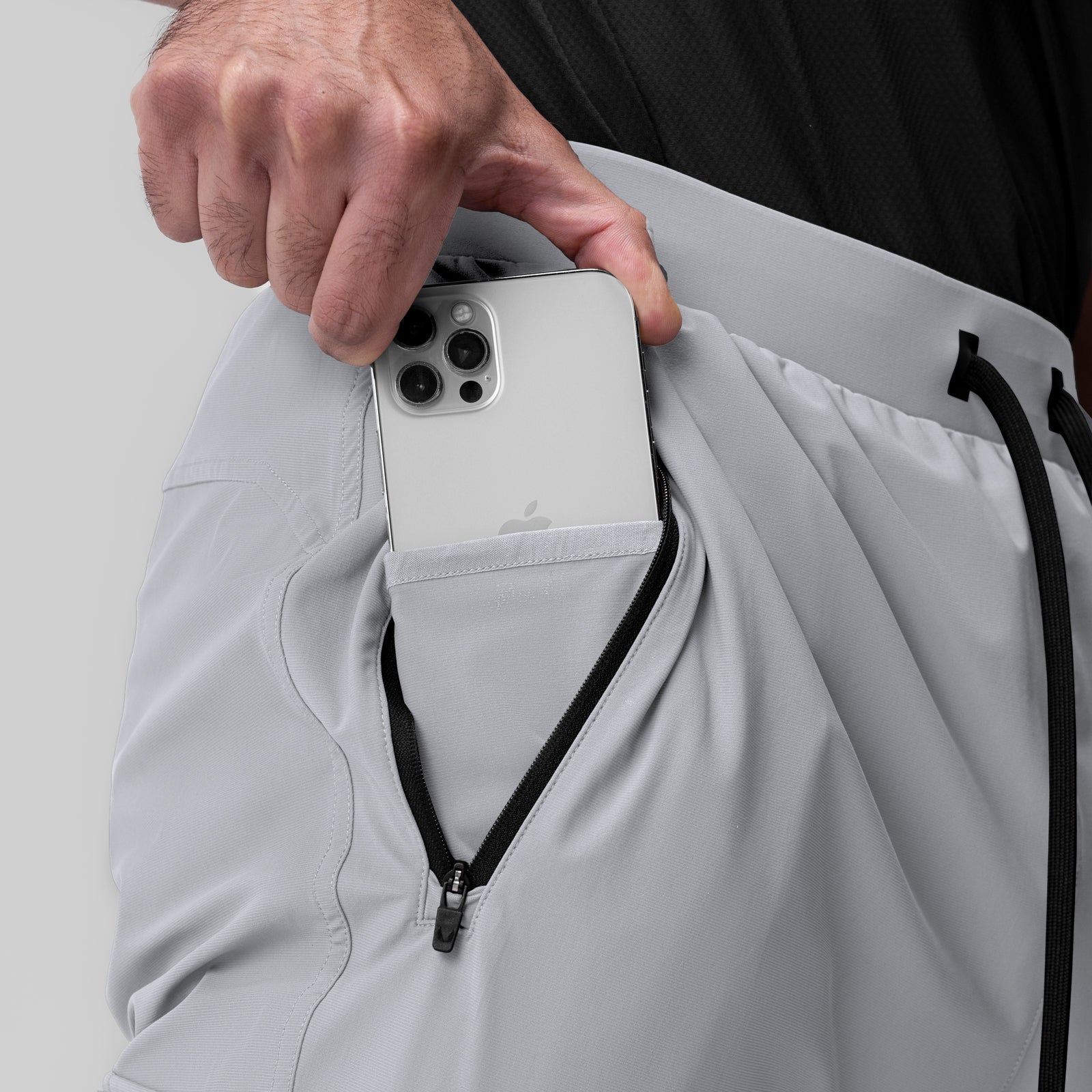 Tetra-Lite Ice Cargo jogger in slate grey, modeled with phone in chest pocket