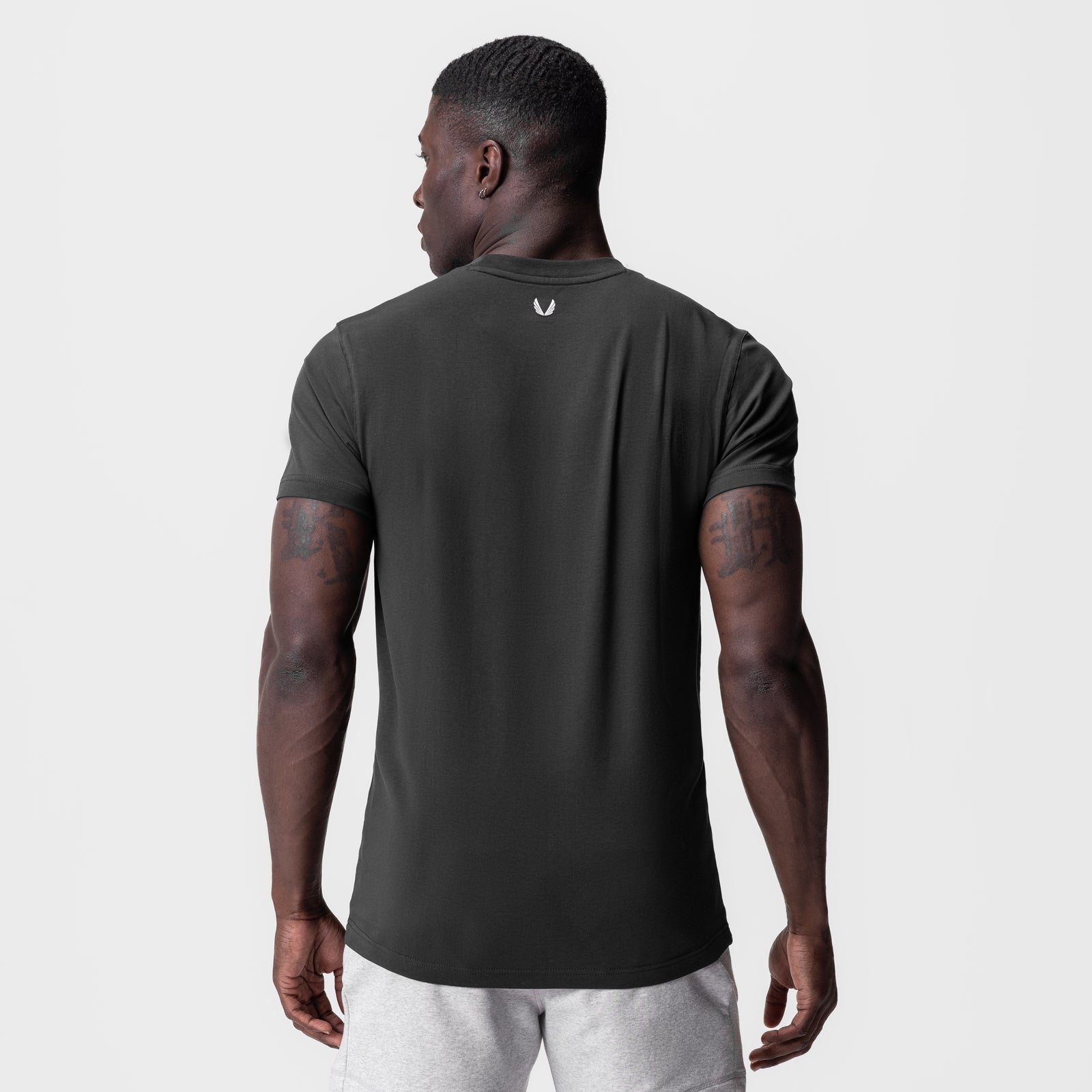 Supima Essential Tee in space grey, worn by model shown from back