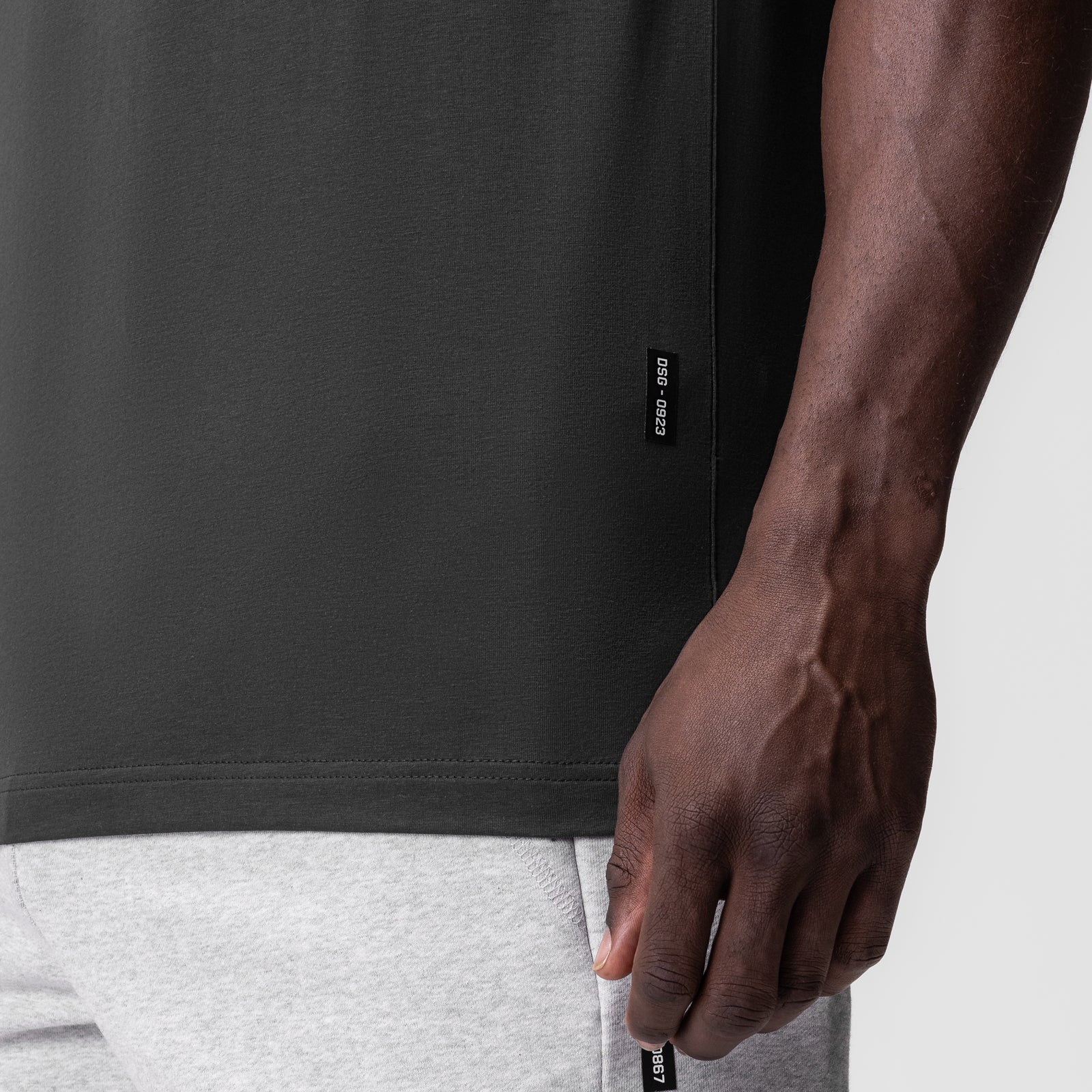 Supima Essential Tee in Space Grey worn by model, side detail view