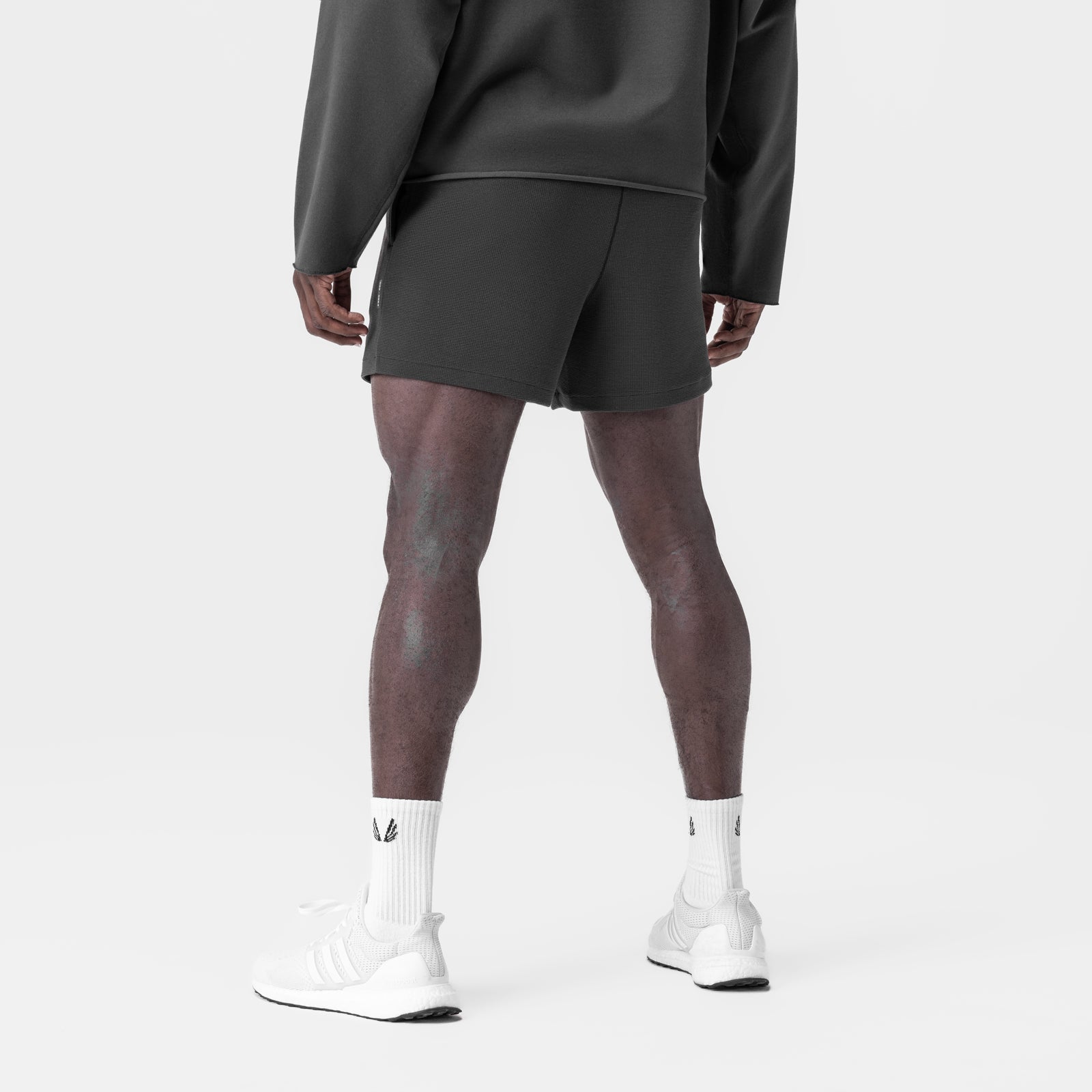 Waffle Knit Sweat Short in space grey, worn by model with white socks, back view