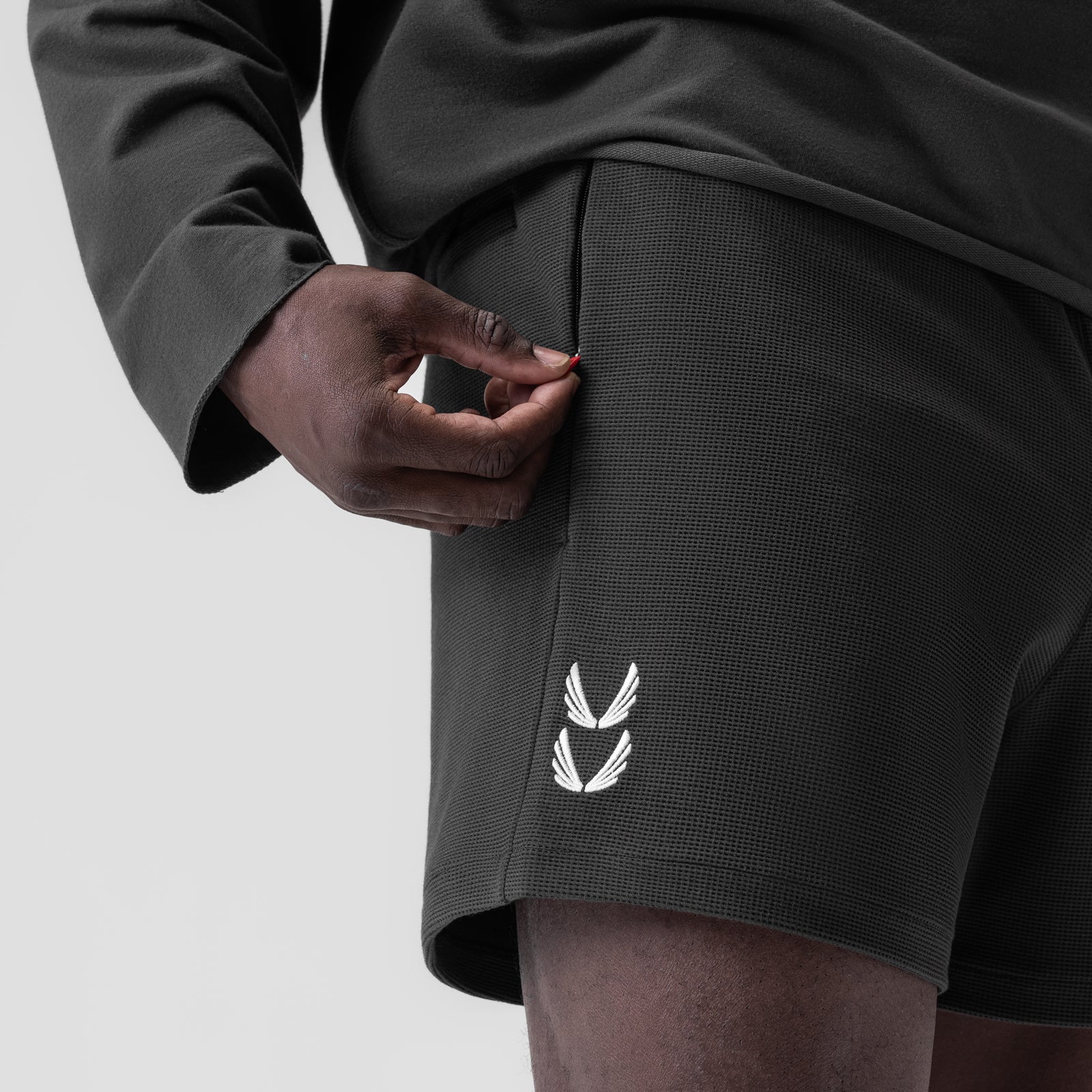 Waffle knit sweat shorts in space grey worn by model, side detail view