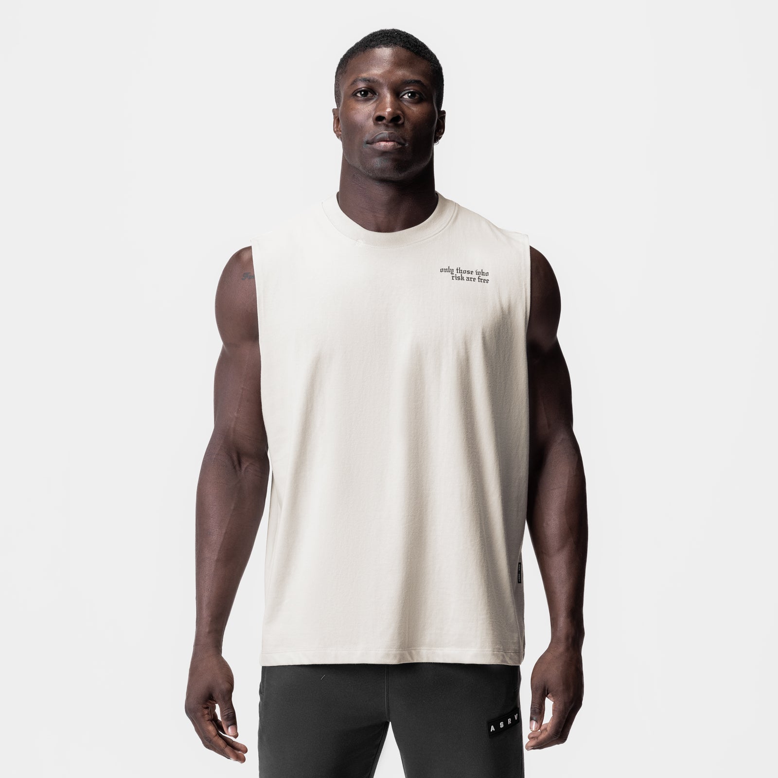 Tech Essential Relaxed Cutoff sleeveless tank in stone, worn by model, front view