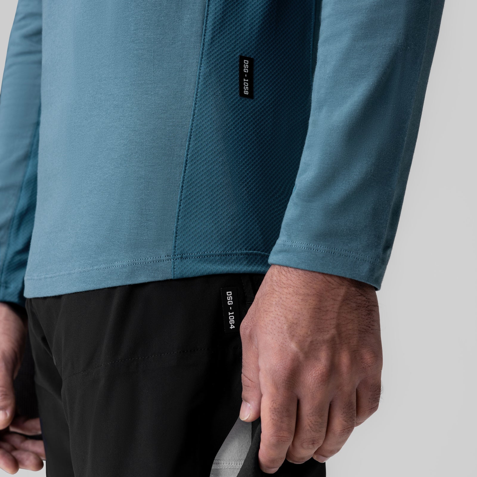 Storm blue long sleeve shirt on model, closeup of sleeve and torso detail