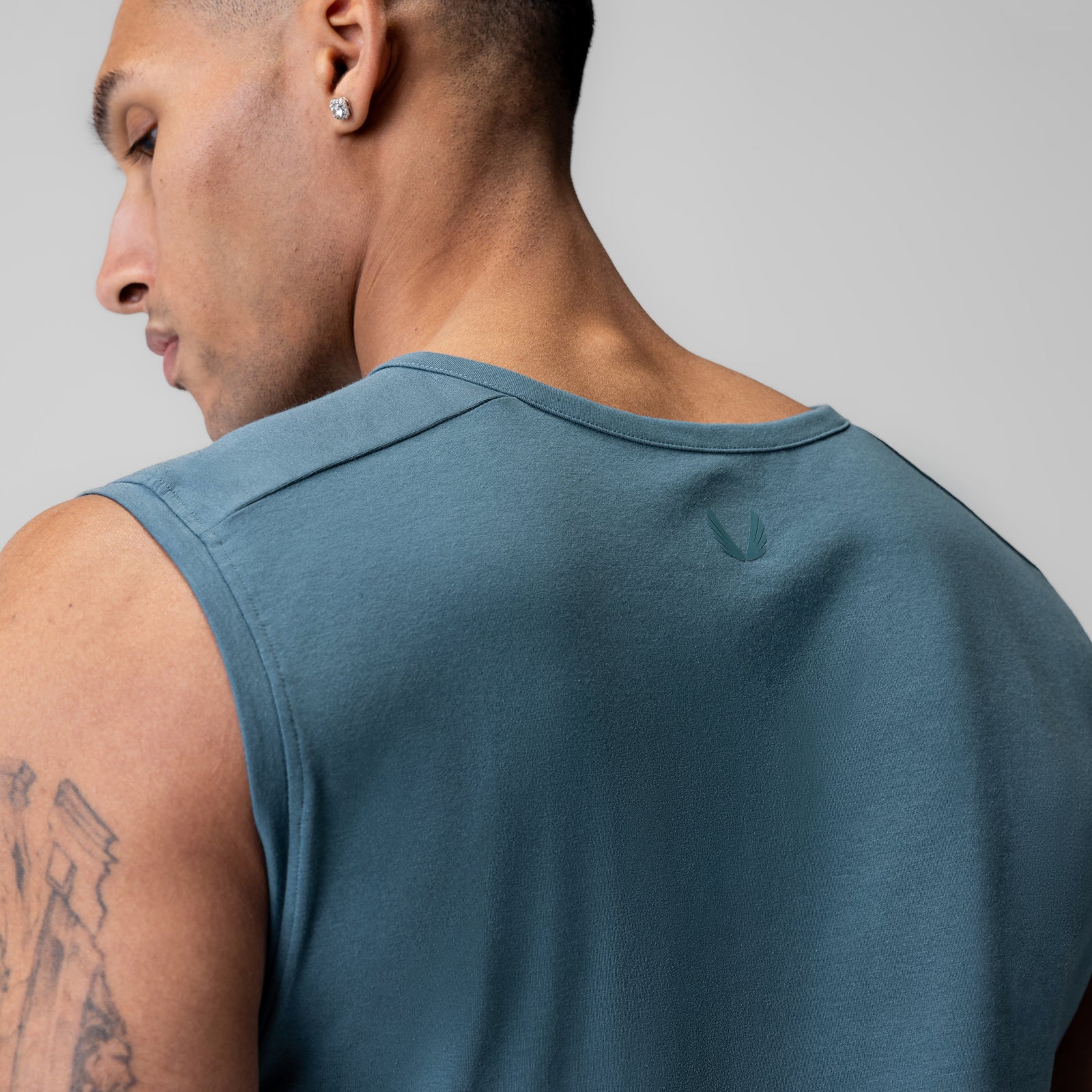 Creora® Cotton Modal Cutoff Tank in storm blue, worn by model in profile view