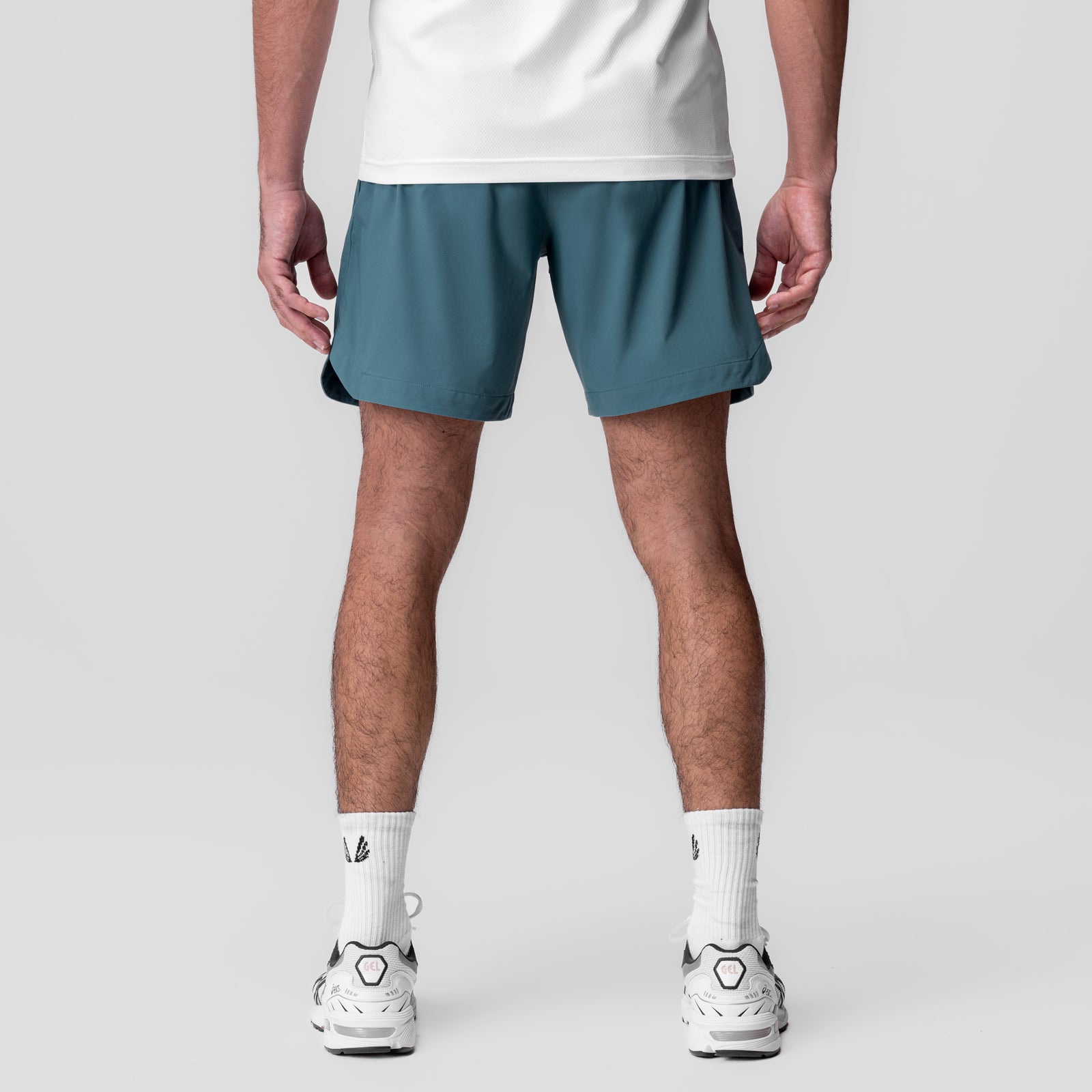 Tetra-Lite 7" Linerless Short in storm blue, worn by model, back view