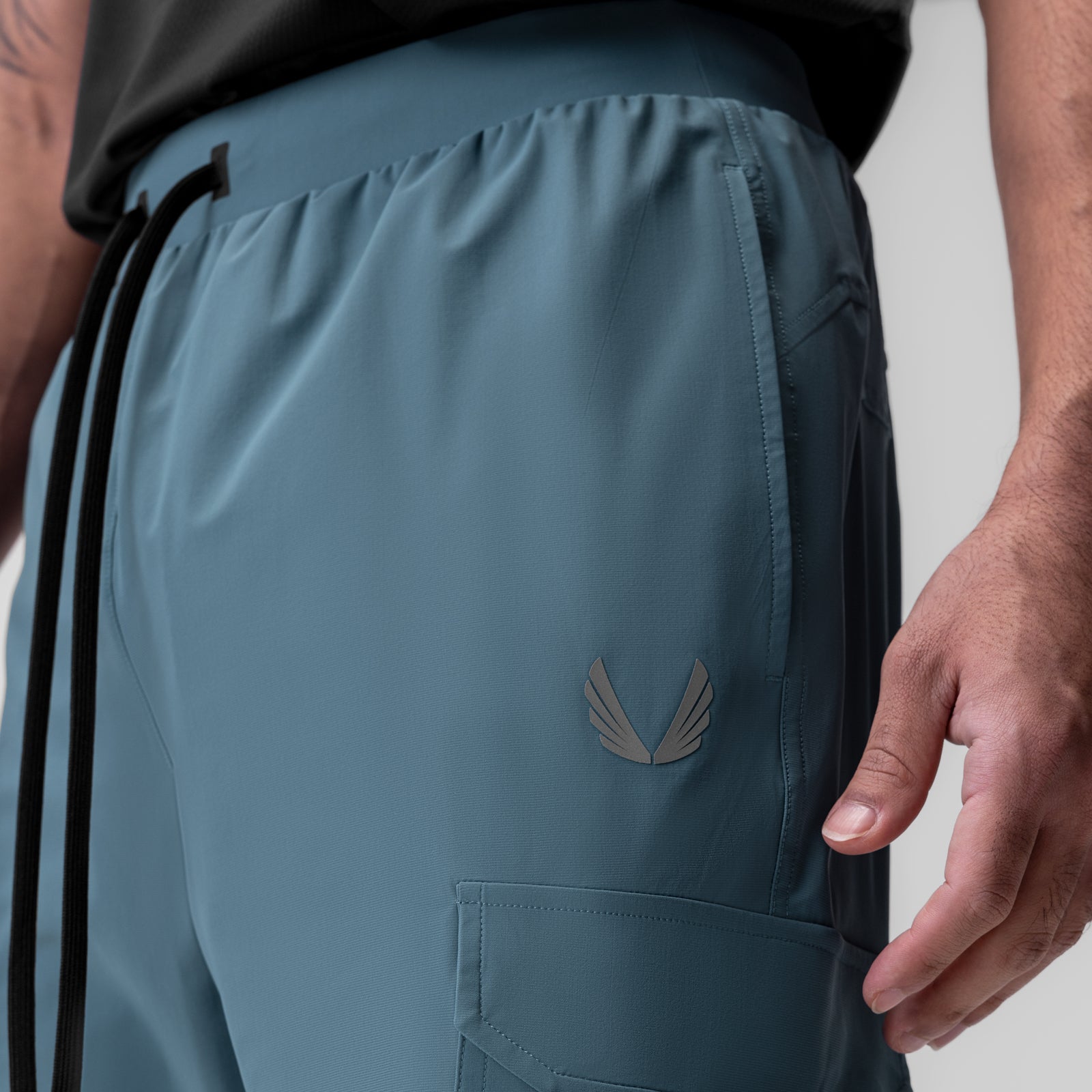 Tetra-Lite Ice Cargo High Rib Jogger in storm blue, worn by model, side detail view
