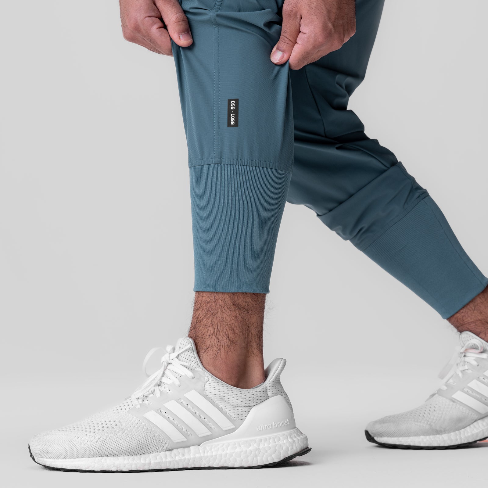 Tetra-Lite Ice Cargo High Rib Jogger in Storm blue, worn by model with white sneakers