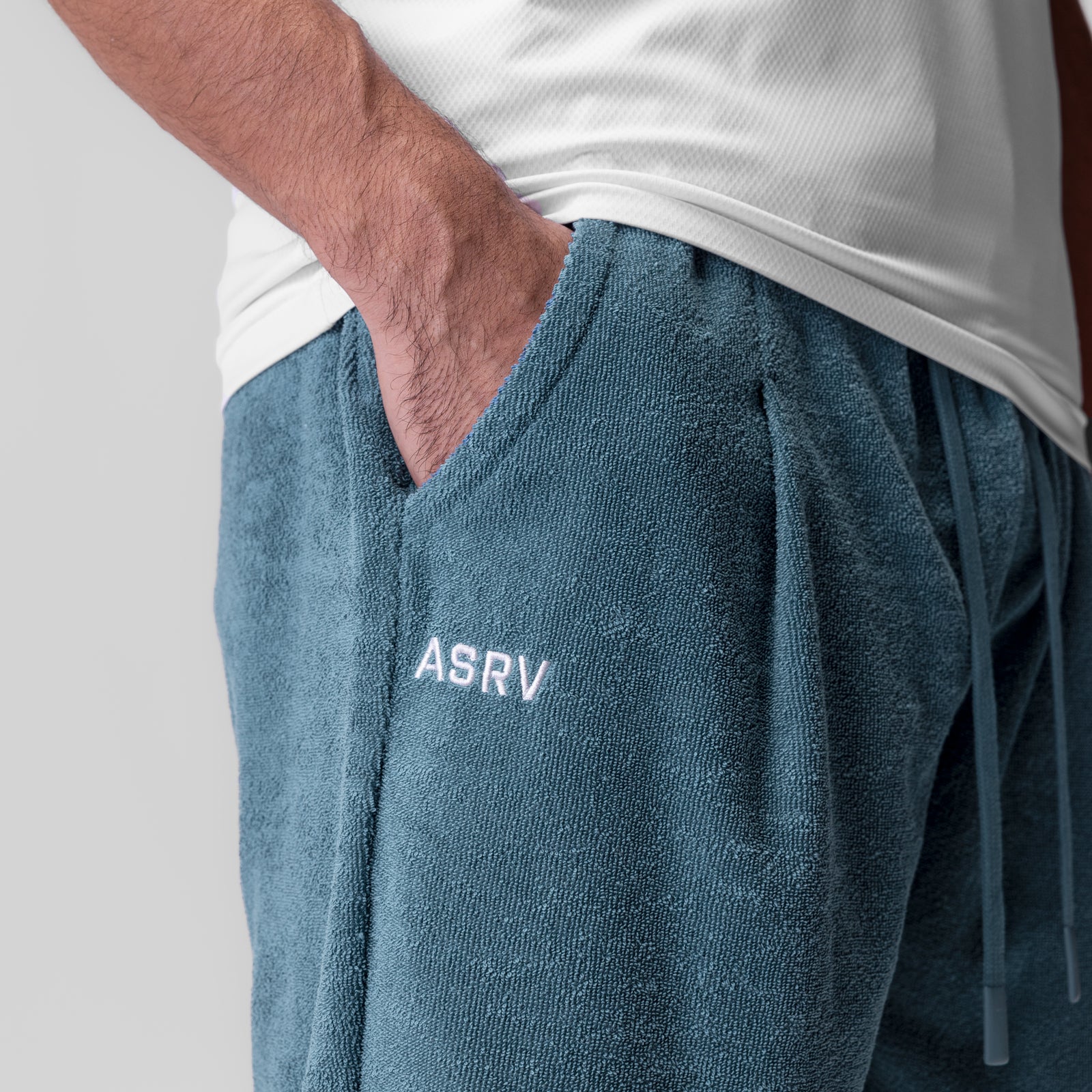 Towel Terry Relaxed Short in storm blue, worn by model with hand in pocket