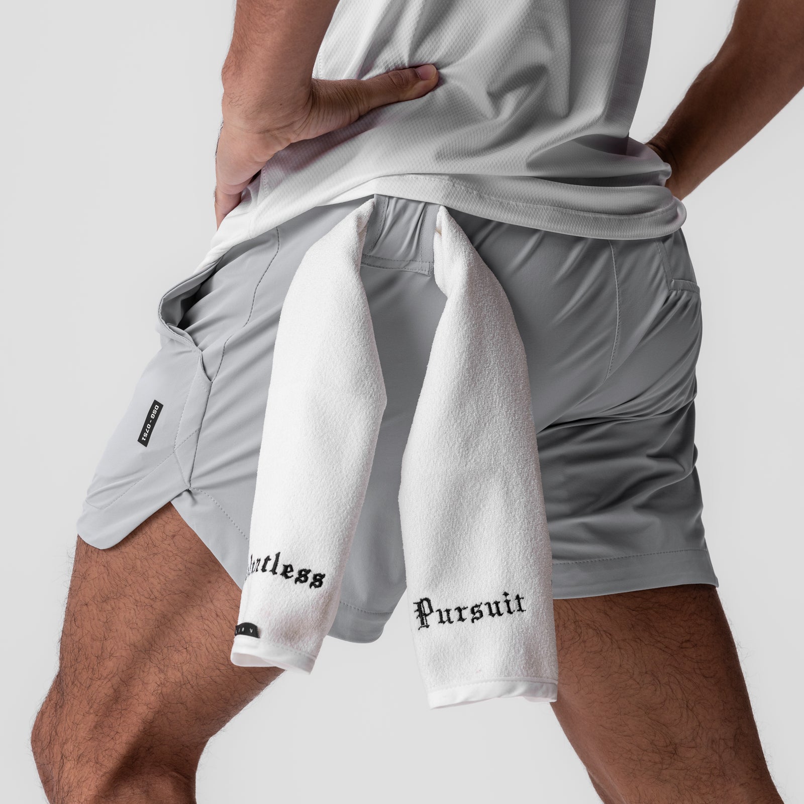 Tetra-Lite 5" Linerless Shorts in slate grey worn with white towel, side view