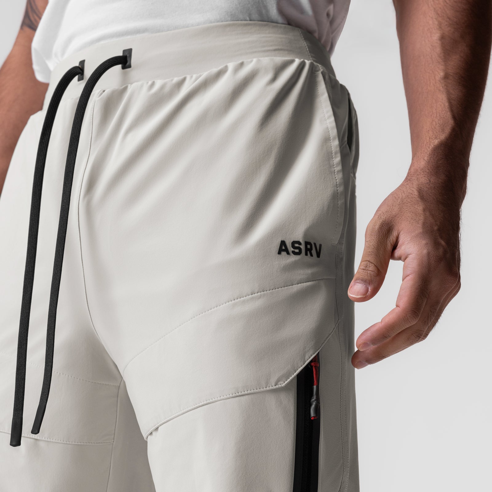 ASRV Tetra-Lite Tech High Rib Jogger in stone, worn by model showing side detail
