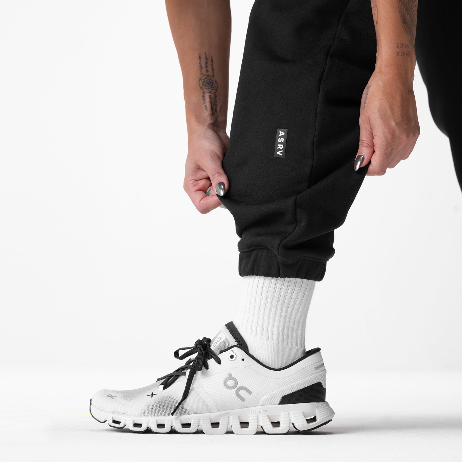 Black ASRV Sorona French-Terry Oversized Jogger worn with white socks and sneakers, side view