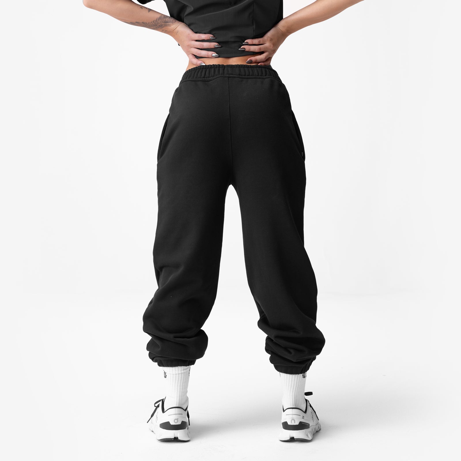 Black ASRV Sorona French-Terry oversized jogger worn by model, back view