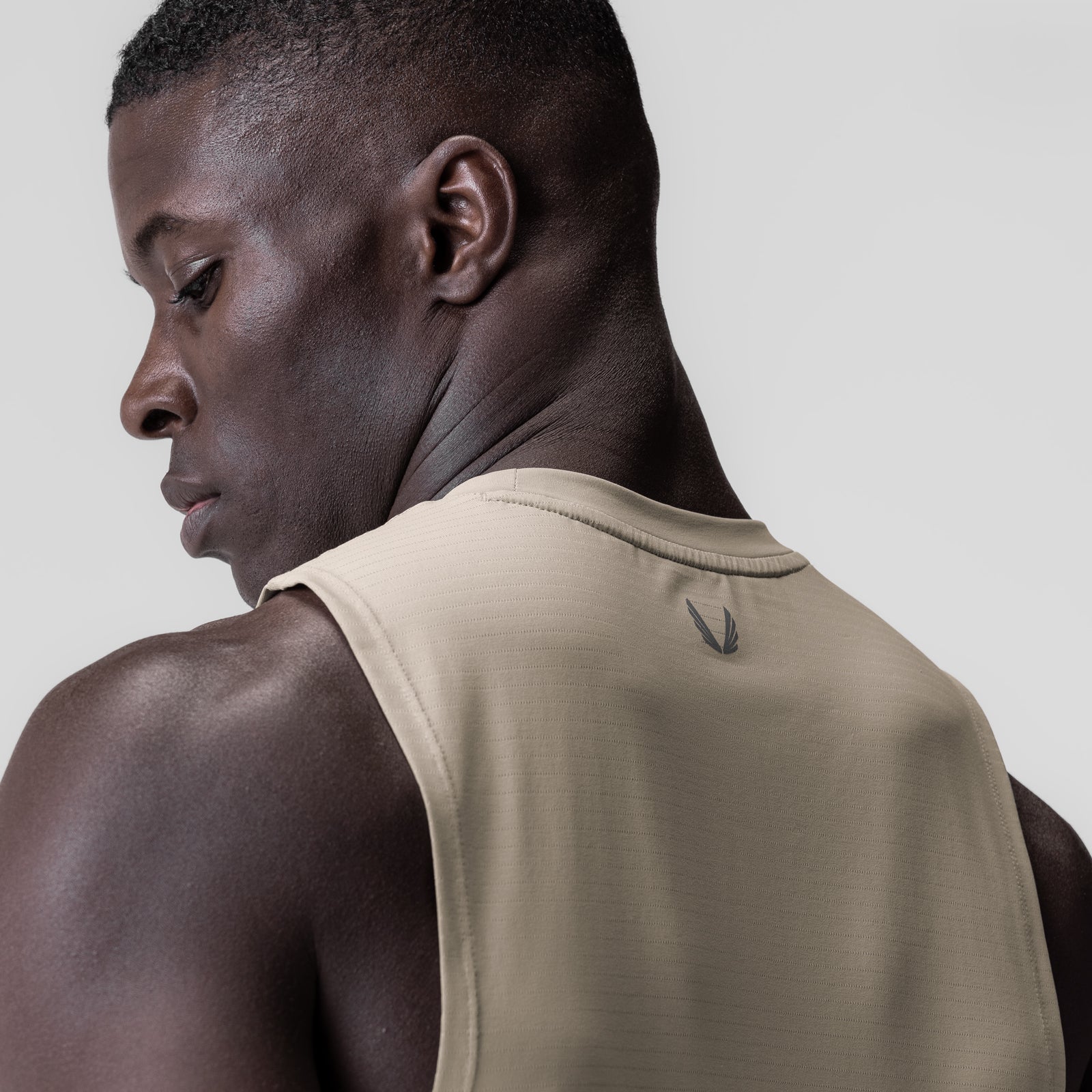 3D-Lite® 2.0 Lycra® Muscle Tank in Sand Smoke, worn by model in profile view