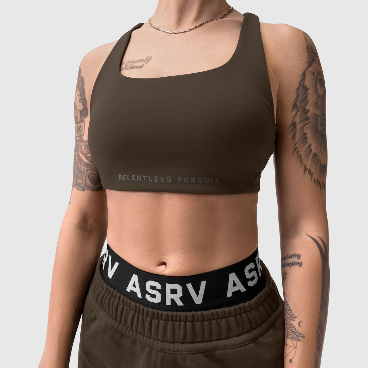 LYCRA® Hybrid Sports Bra in Dark Earth worn by model, front view