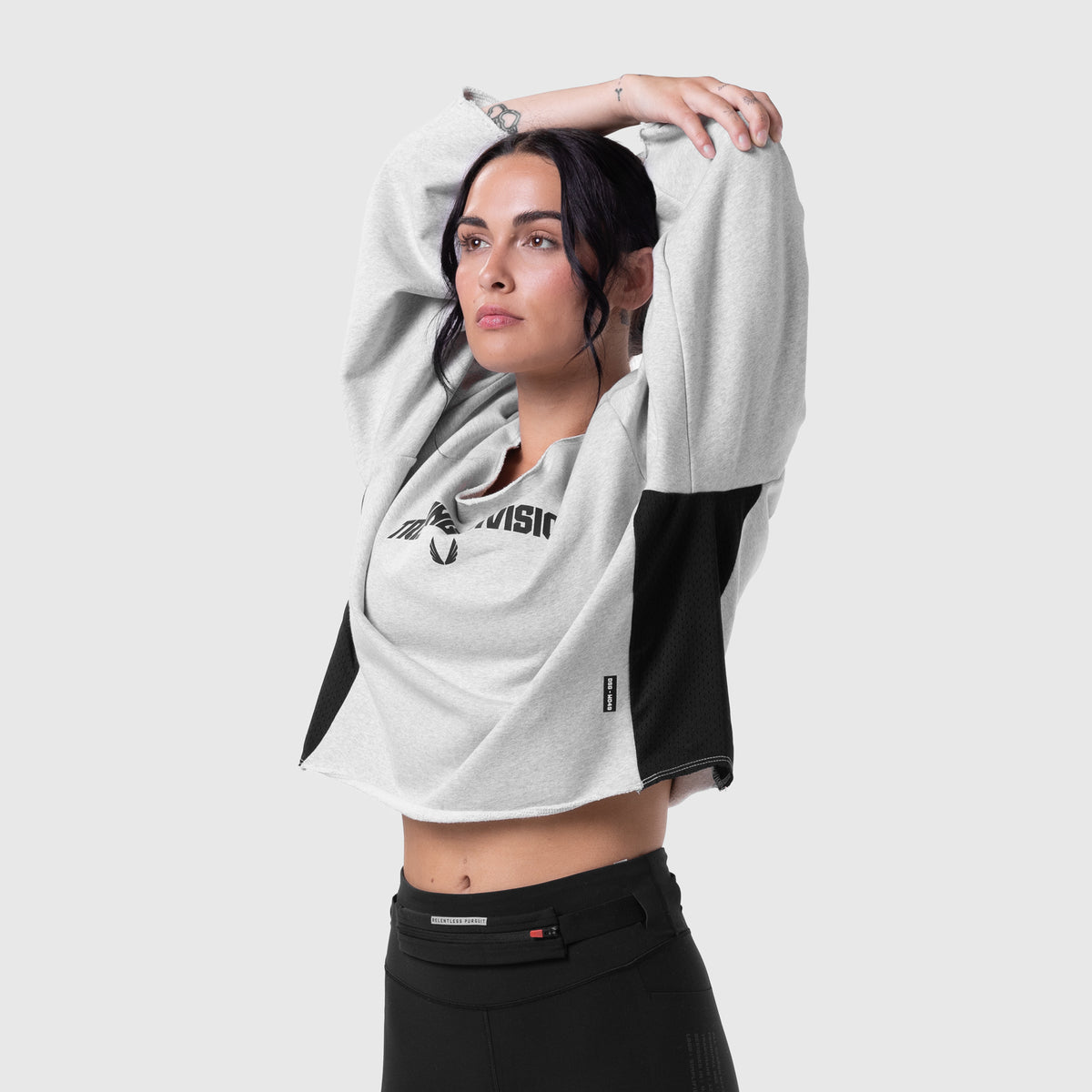 Raw Hem Oversized Crewneck in heather grey and black, worn by model with arms raised
