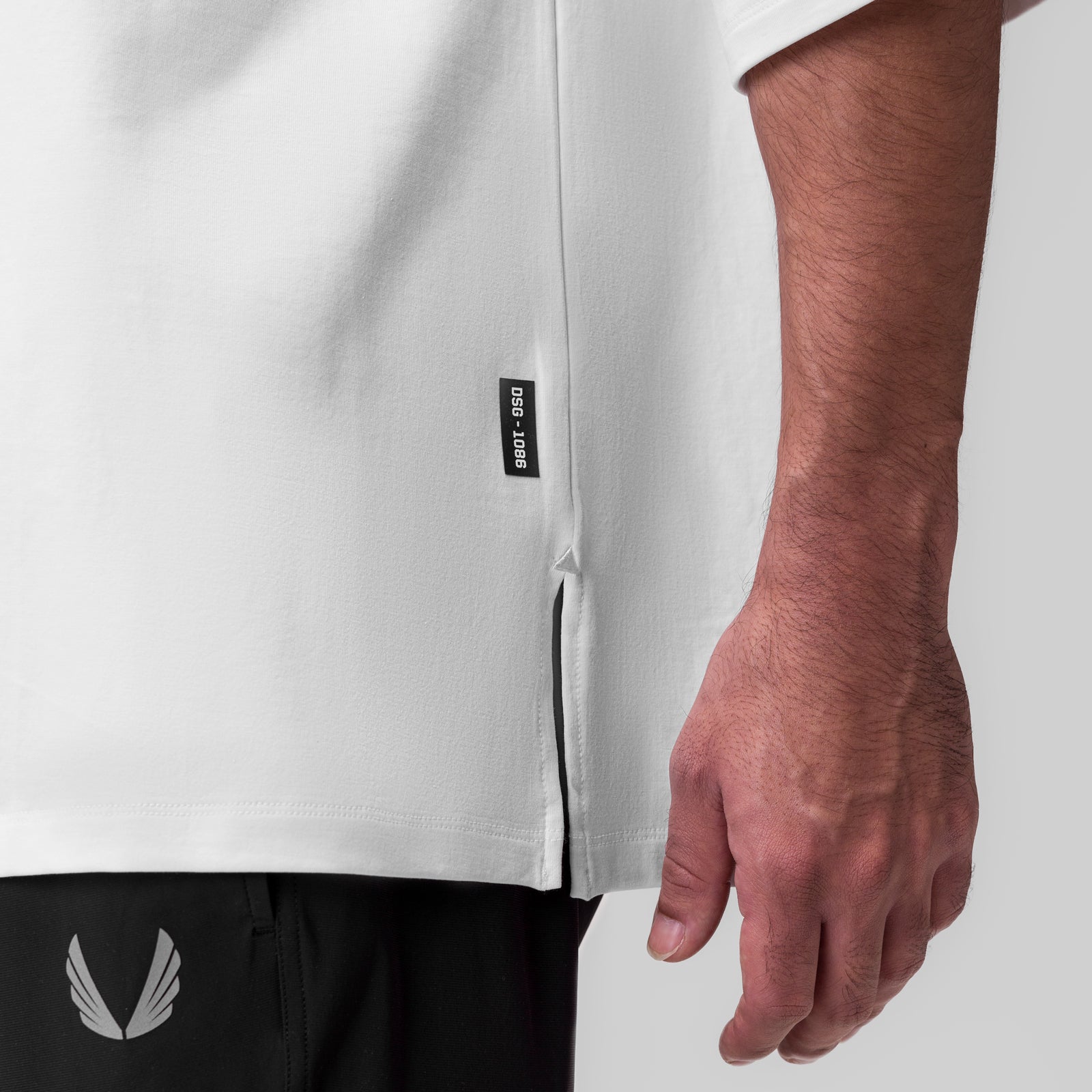 White Supima® 3/4-sleeve oversized tee worn by model, side view showing fit and fabric detail