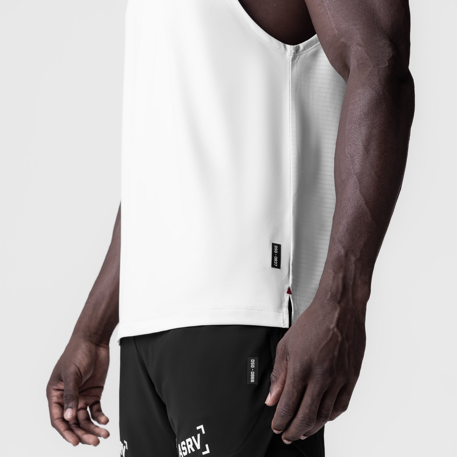 White 3D-Lite® 2.0 Lycra® Muscle Tank worn by model, side view