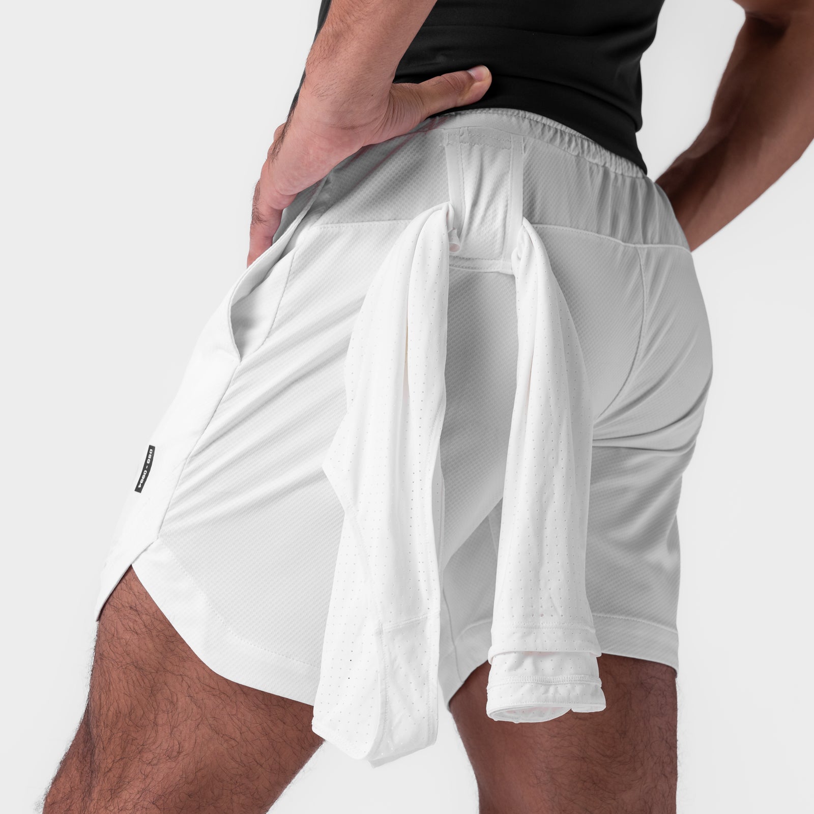 AeroSilver 7" Linerless Short in white, worn by model showing back pocket detail