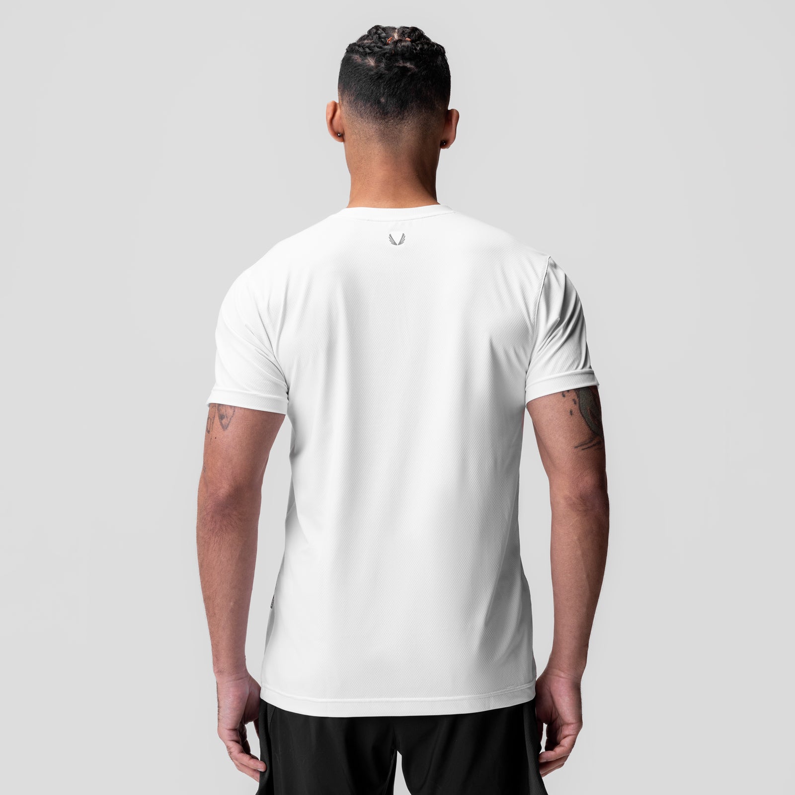 White AeroSilver Essential Tee worn by model, back view