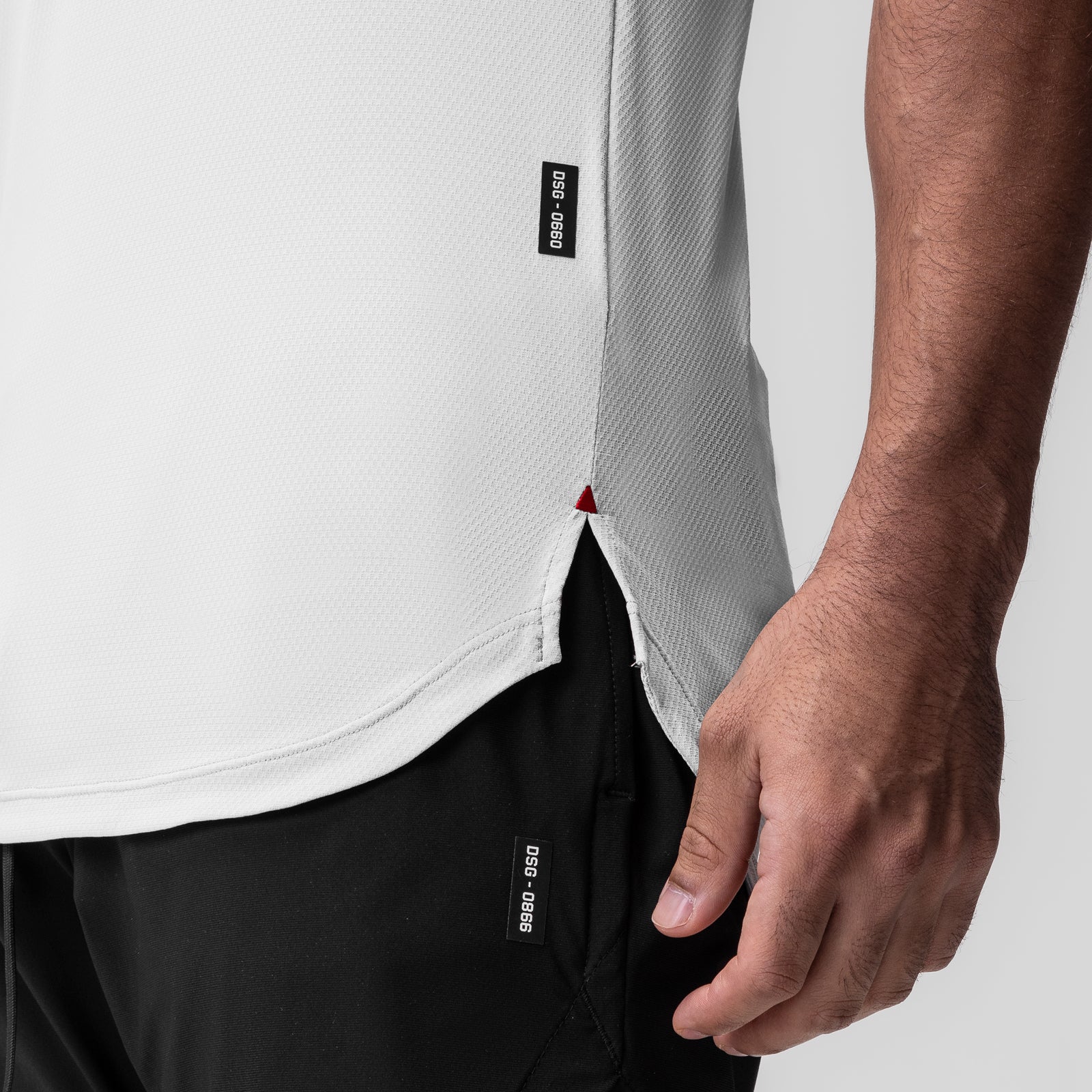 White AeroSilver Established Tee worn by model, side detail showing fabric texture and label