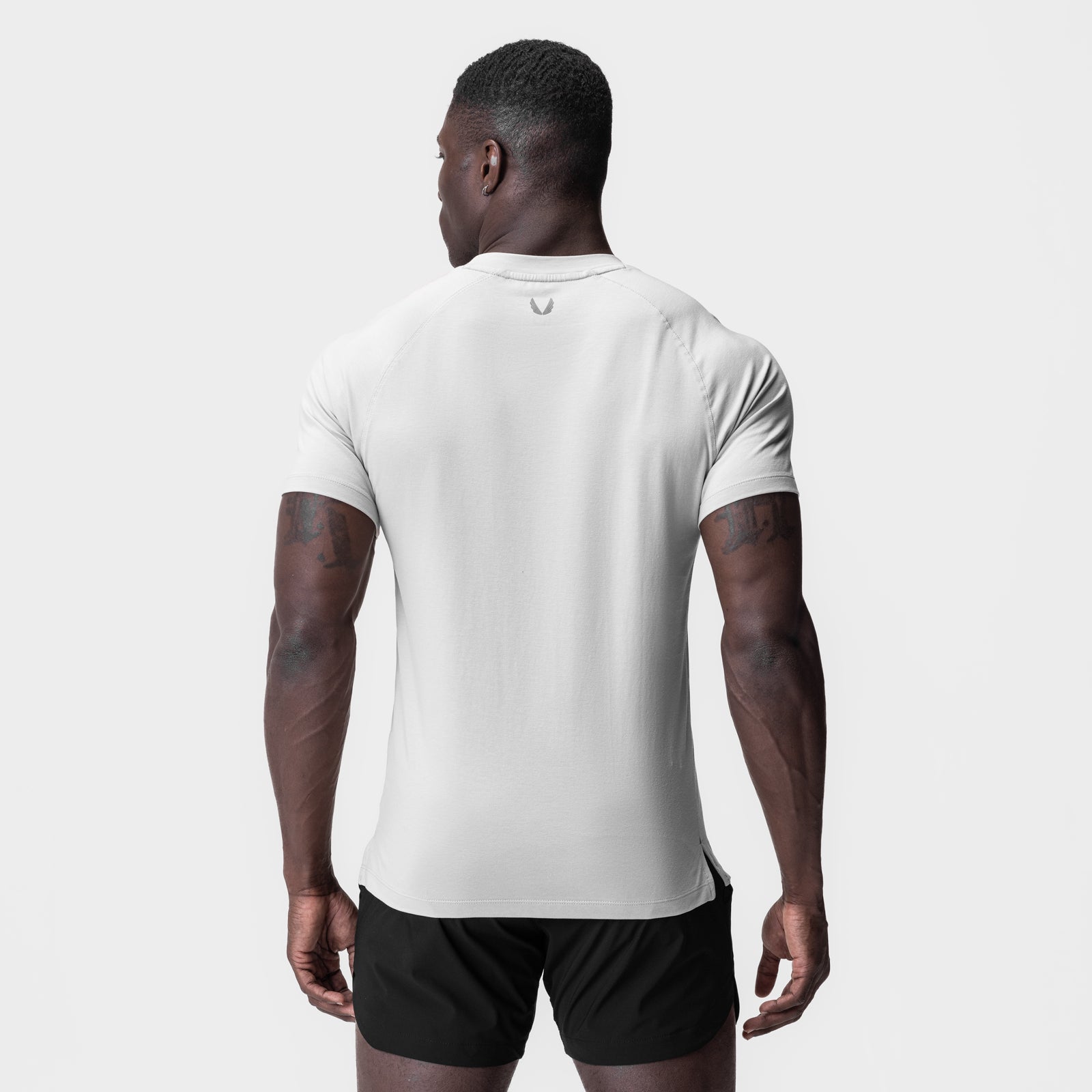 White Supima® Fitted Tee worn by model, back view