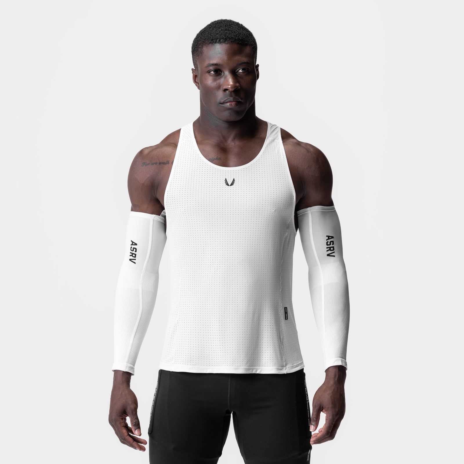 Laser-Vent Singlet Tank in white worn by model with white arm sleeves, front view