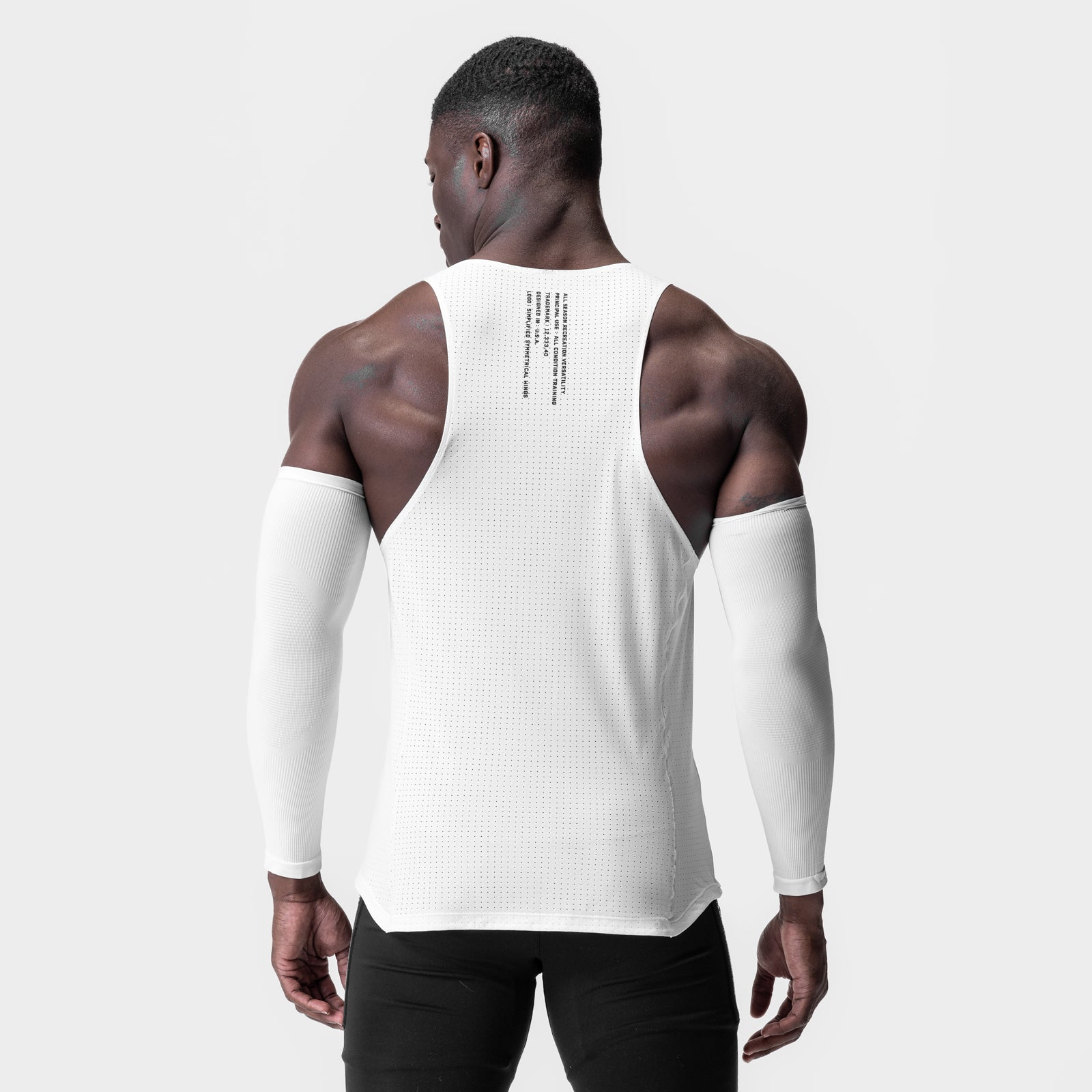 Laser-Vent Singlet Tank in white, worn by model from back view showing muscle definition