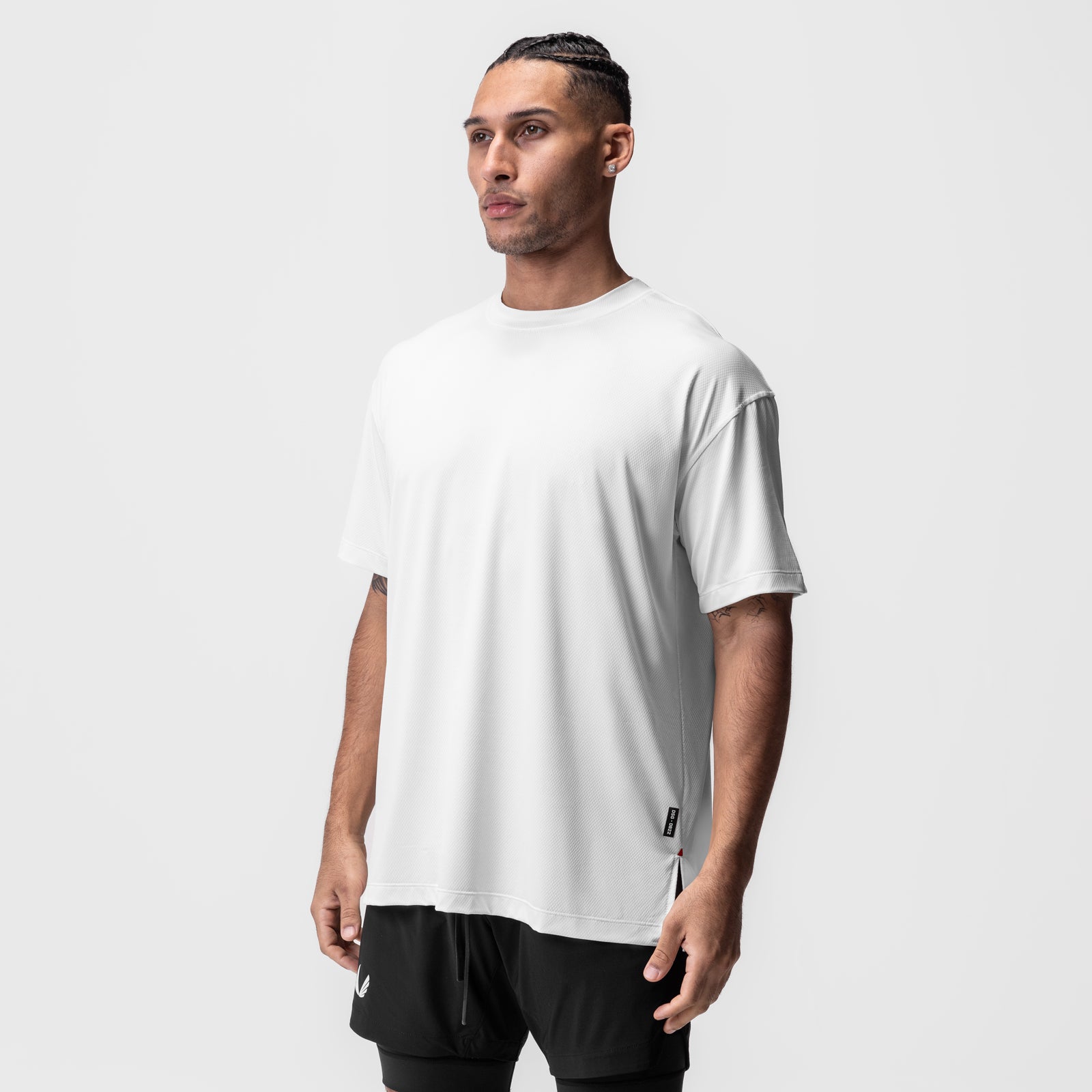AeroSilver Oversized Tee in white, worn by model in side profile