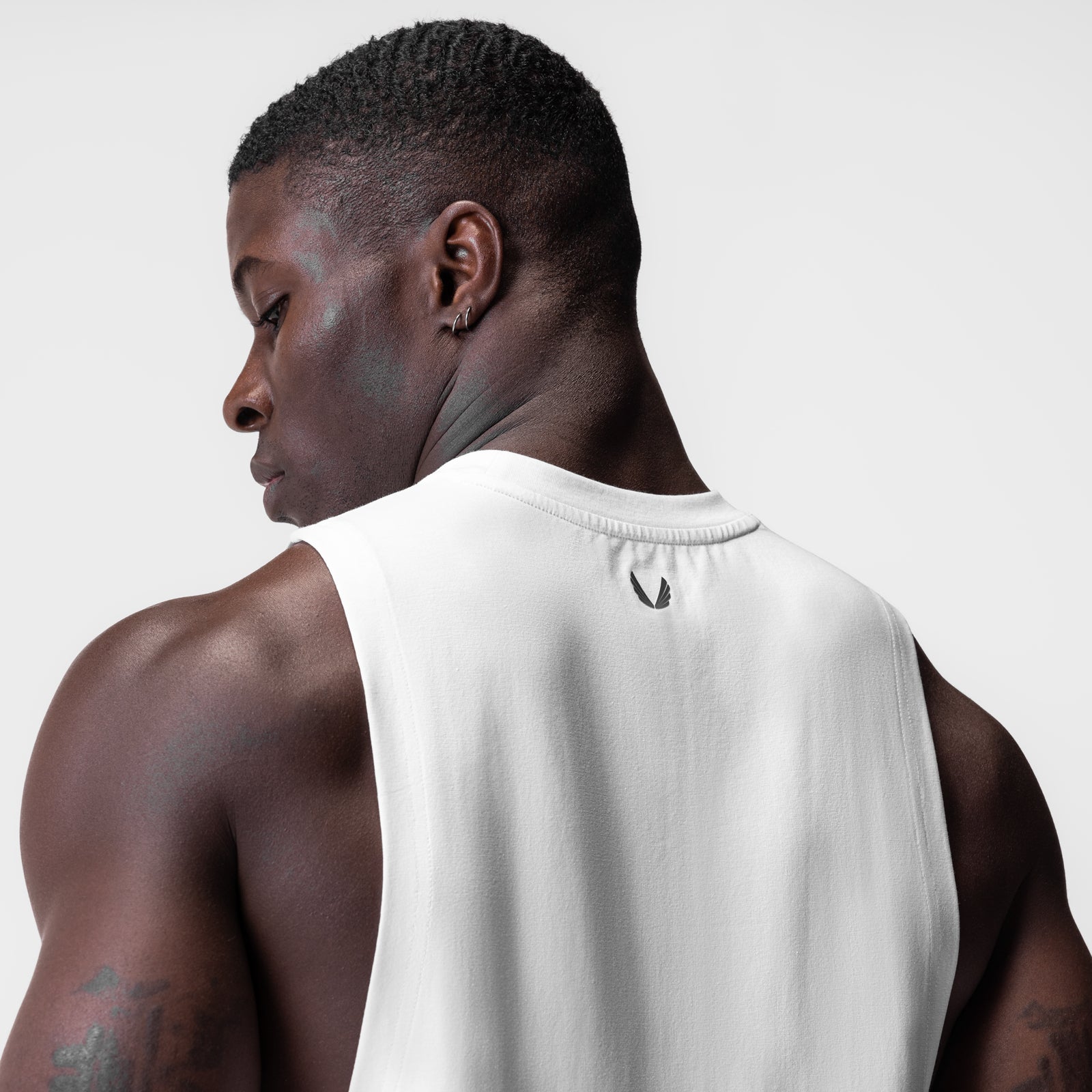 White Supima® Muscle Tank worn by model, rear view