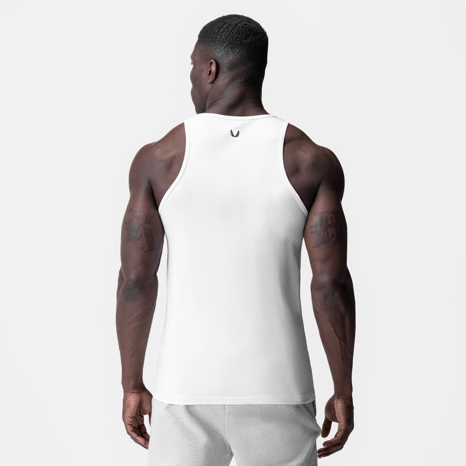 White Supima® Essential Slim Tank worn by model, back view