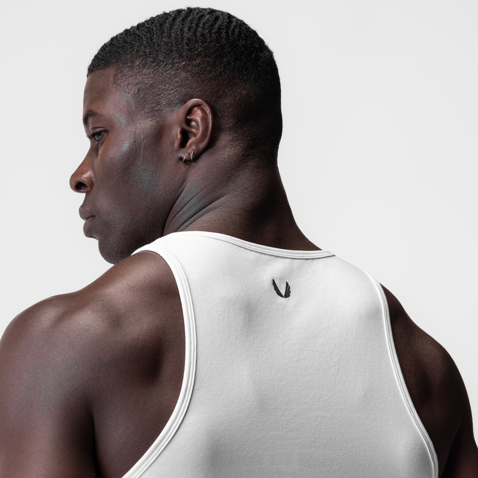 White Supima Essential Slim Tank worn by model, back view