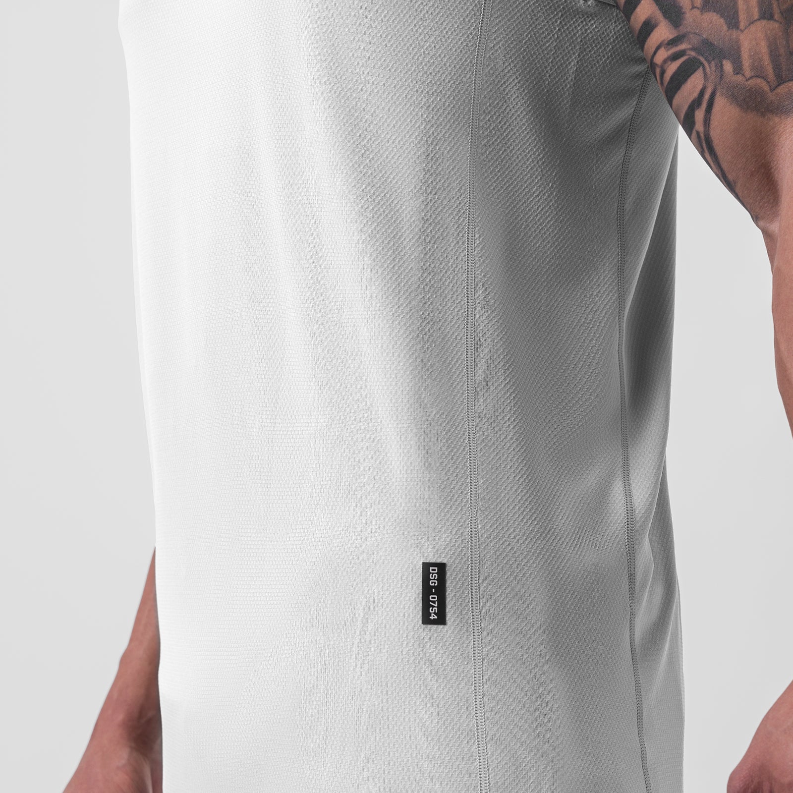 AeroSilver® Training Singlet in white, worn by model showing front detail and side seam