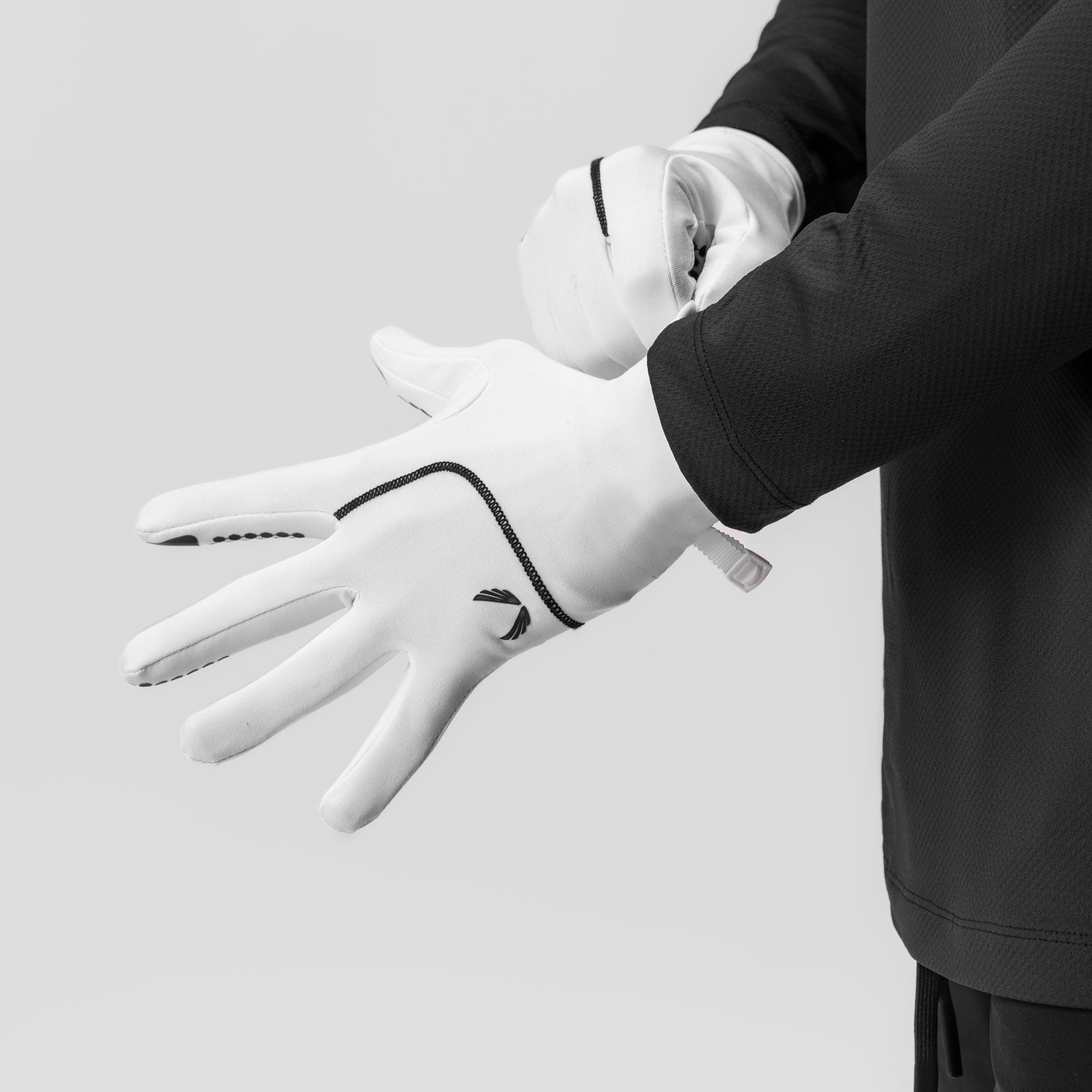 Aeroheat Lightweight Gloves in white, worn on model's hands in neutral pose