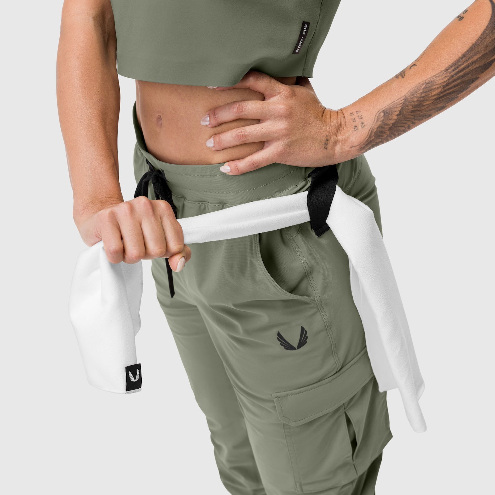 Tetra-Lite Cargo High Rib Jogger in sage, worn by model showing waistband and cargo pocket detail