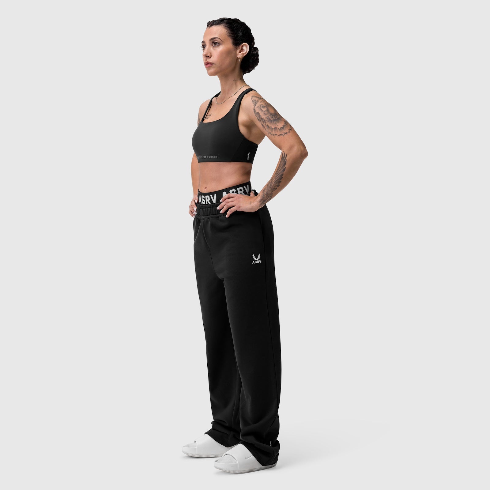 W034 Sorona® Terry Straight Leg Sweats in black, worn by model standing in profile pose