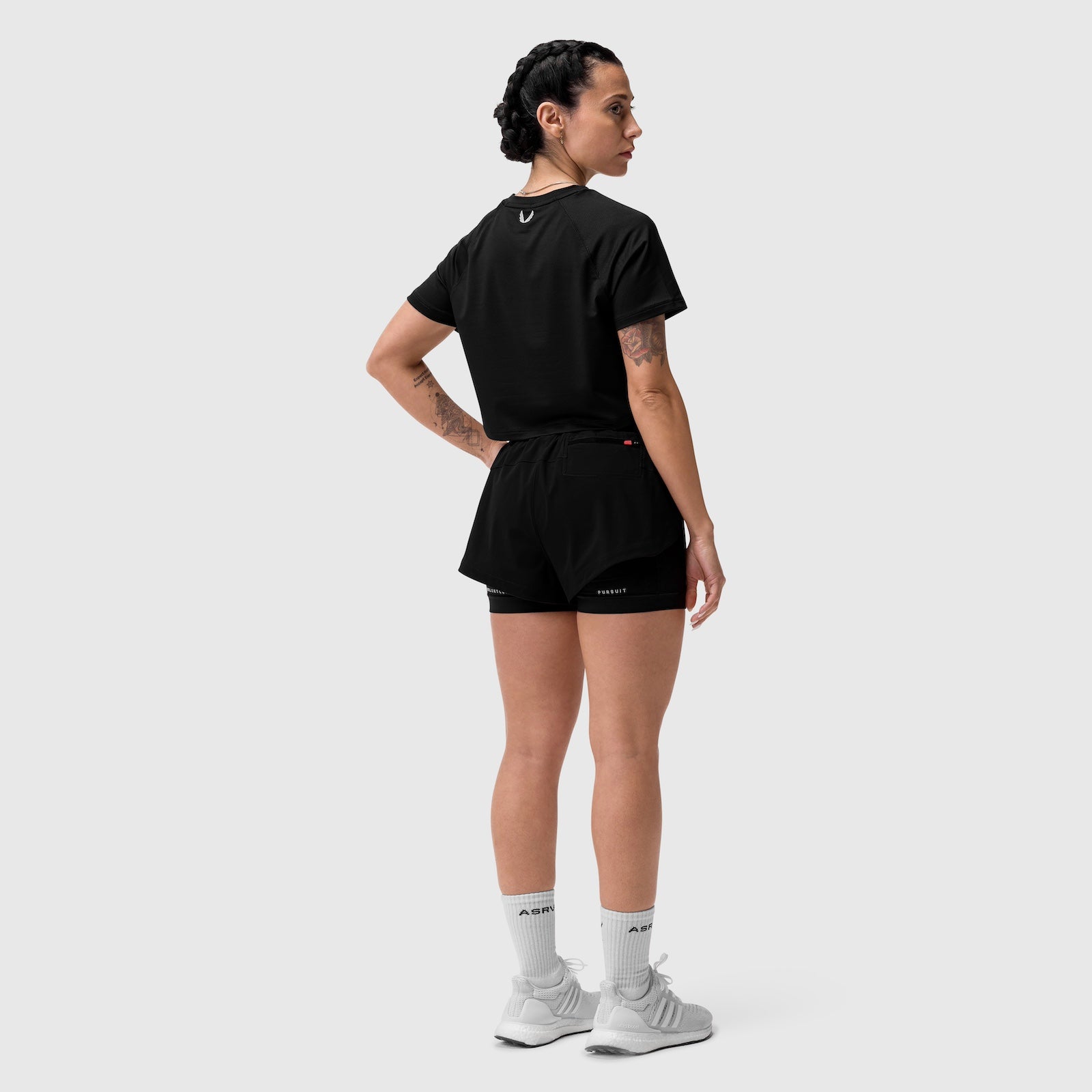 Tetra-Lite® Liner Short in black, worn by model shown from back in profile stance