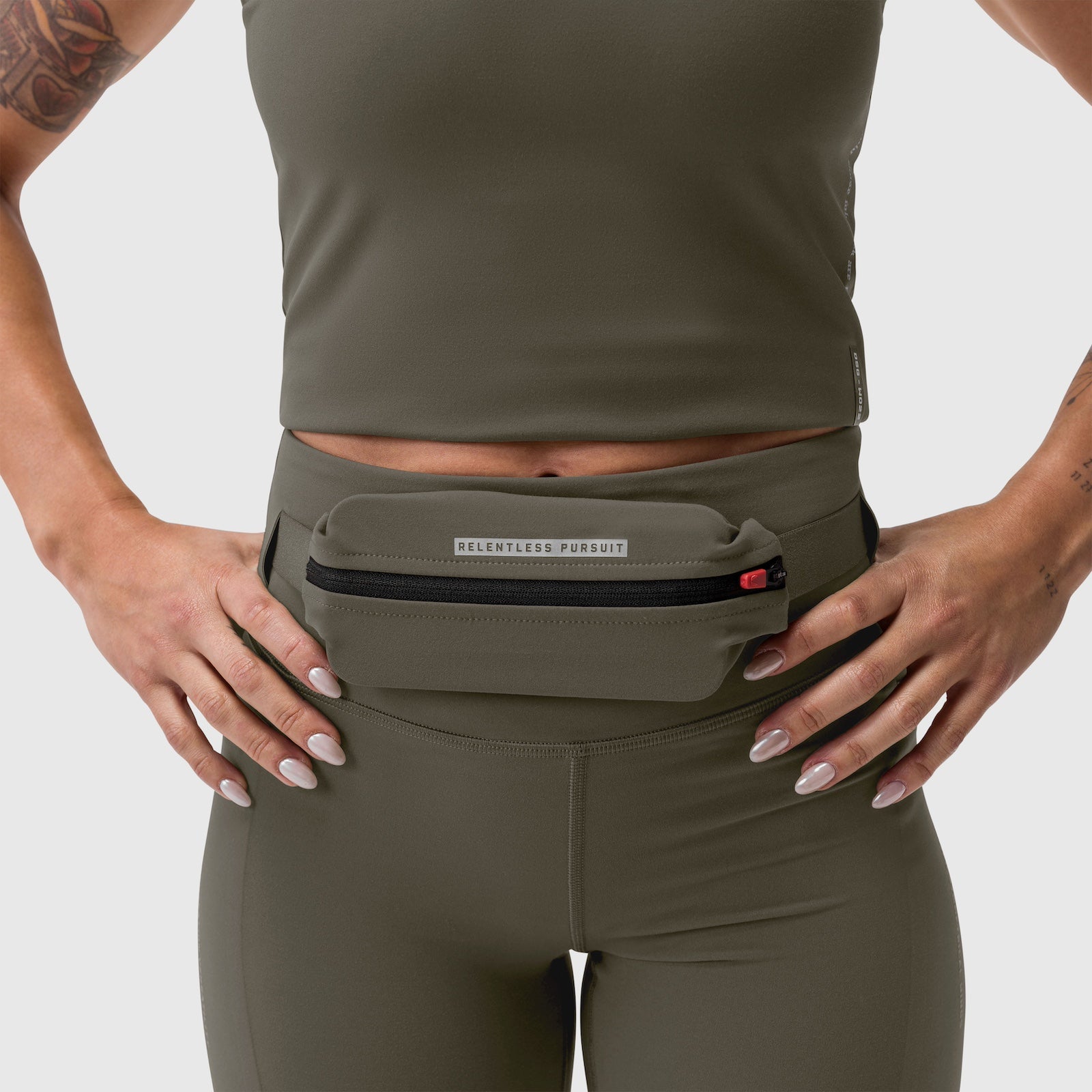 LYCRA® 3-in-1 Legging in olive worn by model, front view with waistband detail