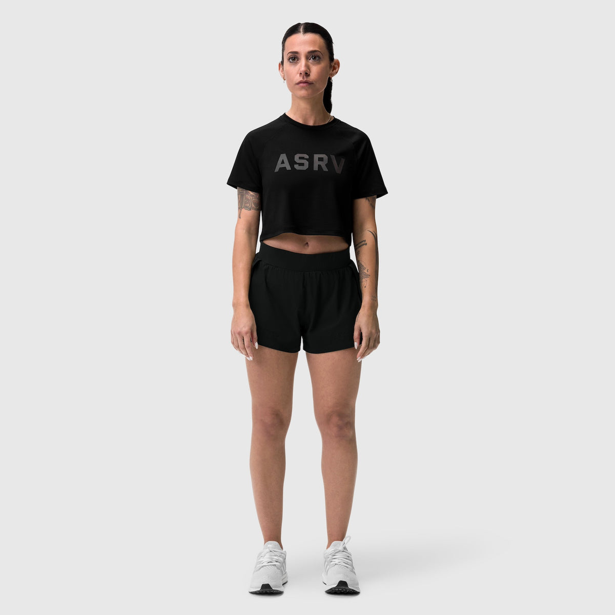 Black ASRV AeroSilver cropped tee worn with black shorts, front view on model